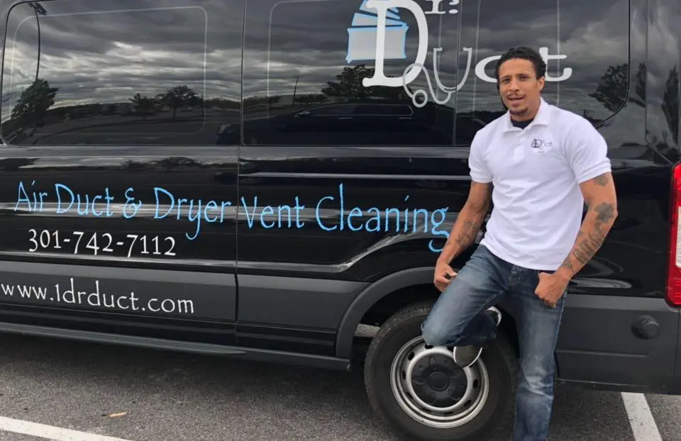 Floyd Roger Myers standing with his Dr. Duct truck (Image via Facebook/Floyd Rocwonder Myers Jr.)