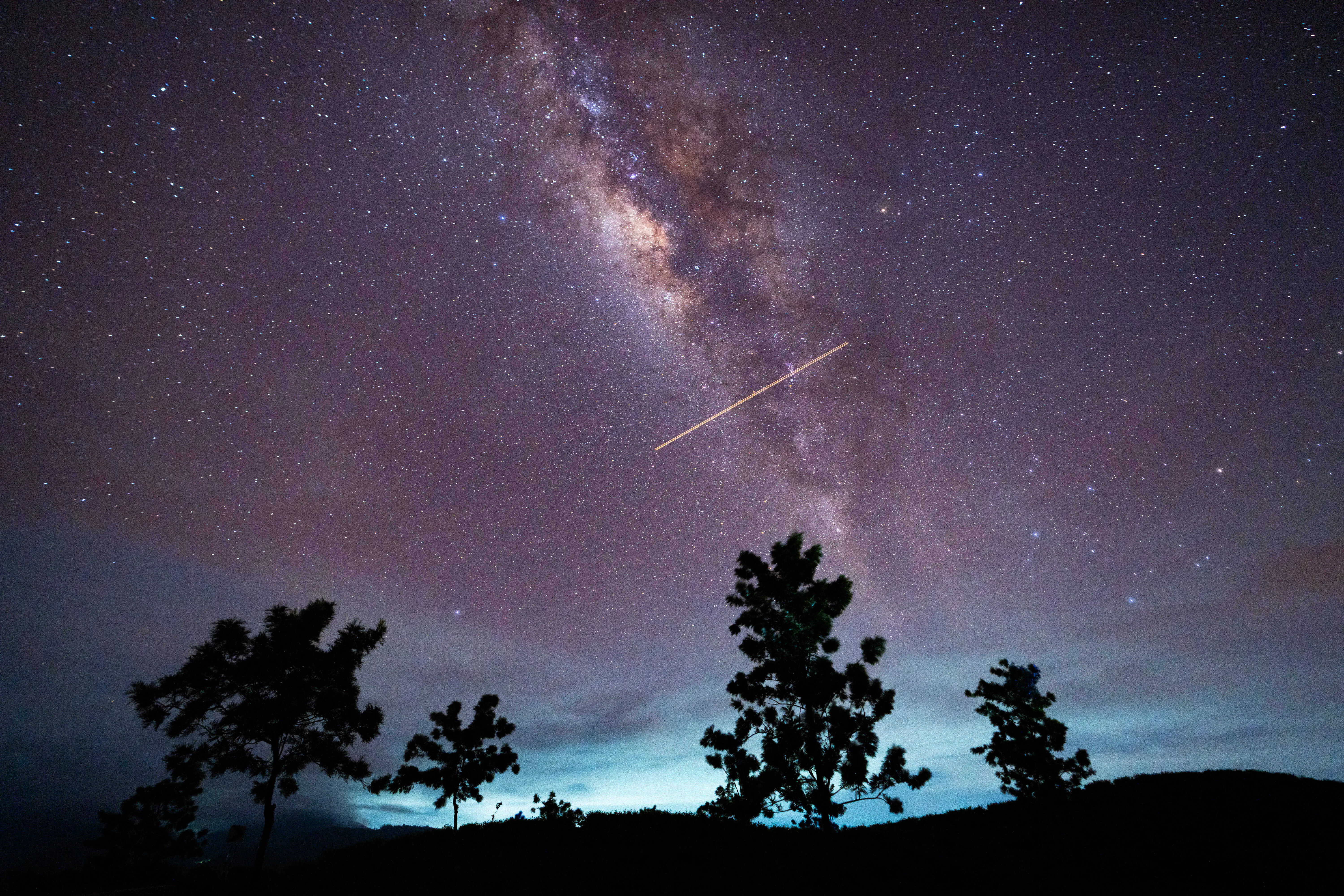 A flight-illuminated path and the Milky Way are appearing in the night sky during the Eta Aquarids meteor shower, which is peaking in Ratnapura, Sri Lanka, on May 5, 2024. The Eta Aquarids Meteor Shower is an annual event caused by Earth passing through debris left behind by Halley's Comet. Named after the constellation Aquarius, these meteors are streaking across the sky at high speeds, creating a dazzling display of shooting stars. Best observed in the predawn hours away from city lights, it is a mesmerizing celestial event cherished by skywatchers worldwide (Image via Getty)