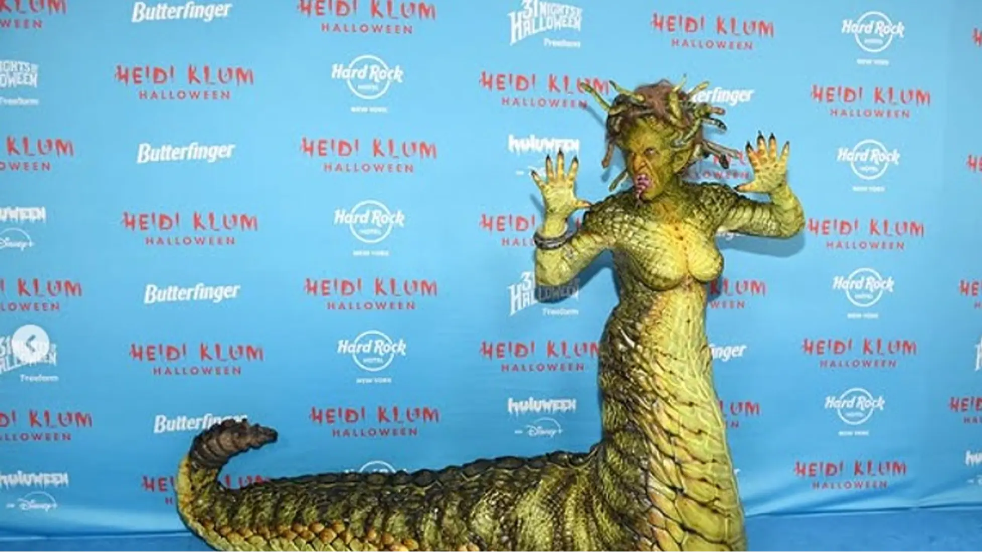 Heidi Klum as Medusa on the blue carpet at her annual Halloween party at Hard Rock Hotel New York, featuring a full-scale tail and animatronic snake crown. Image via Instagram/@heidiklum