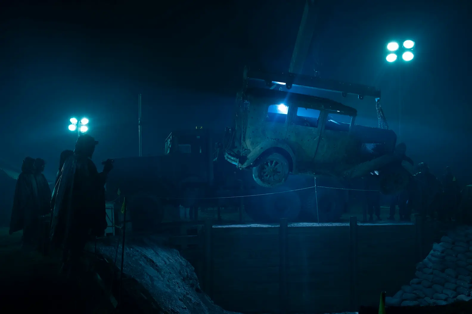 The military team, led by Dick Hallorann, discover a car with bullet holes and dead bodies in the trunk.