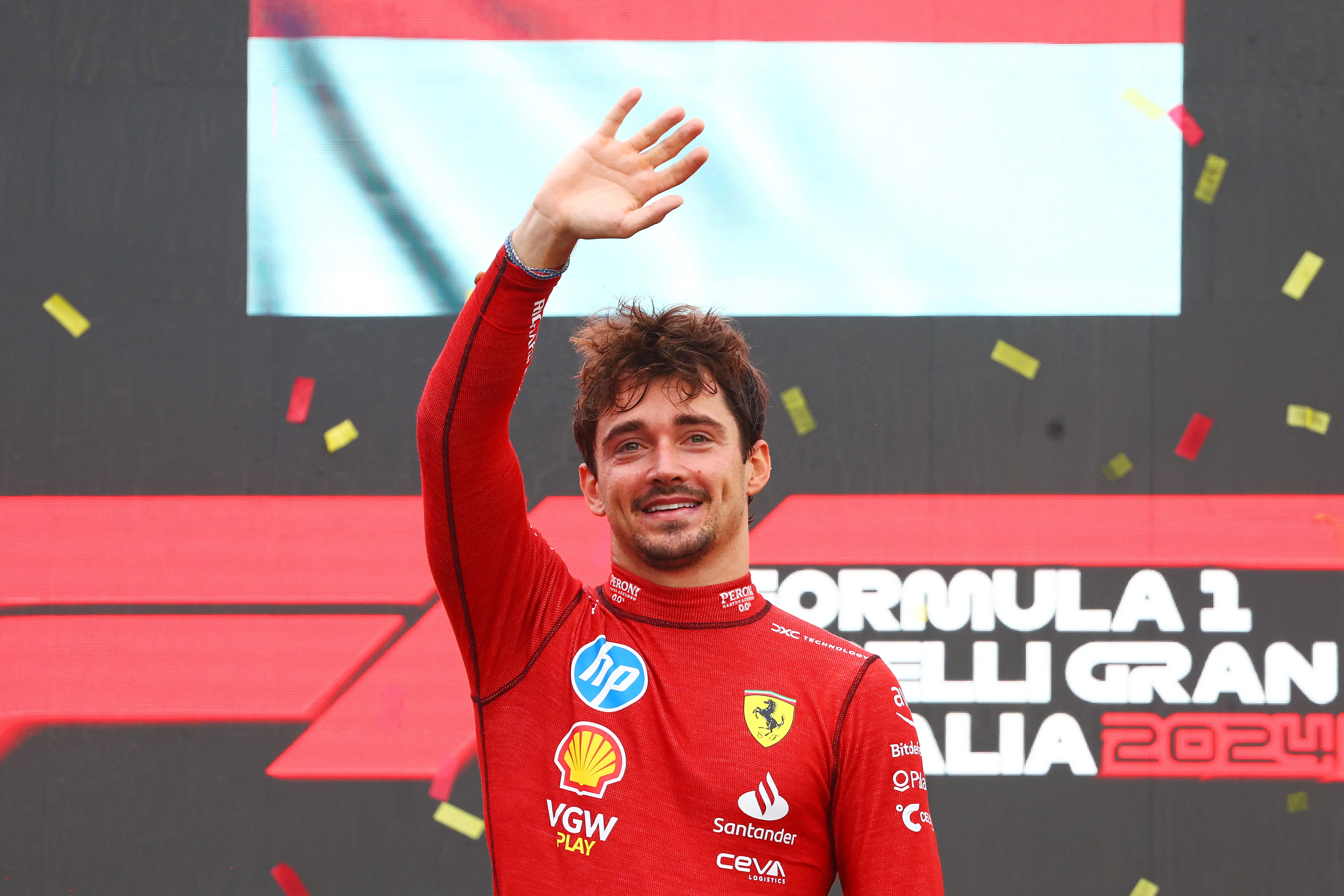 MONZA, ITALY - SEPTEMBER 01: Race winner Charles Leclerc of Monaco and Ferrari celebrates on the podium during the F1 Grand Prix of Italy at Autodromo Nazionale Monza on September 01, 2024 in Monza, Italy. (Photo by Clive Rose/Getty Images)