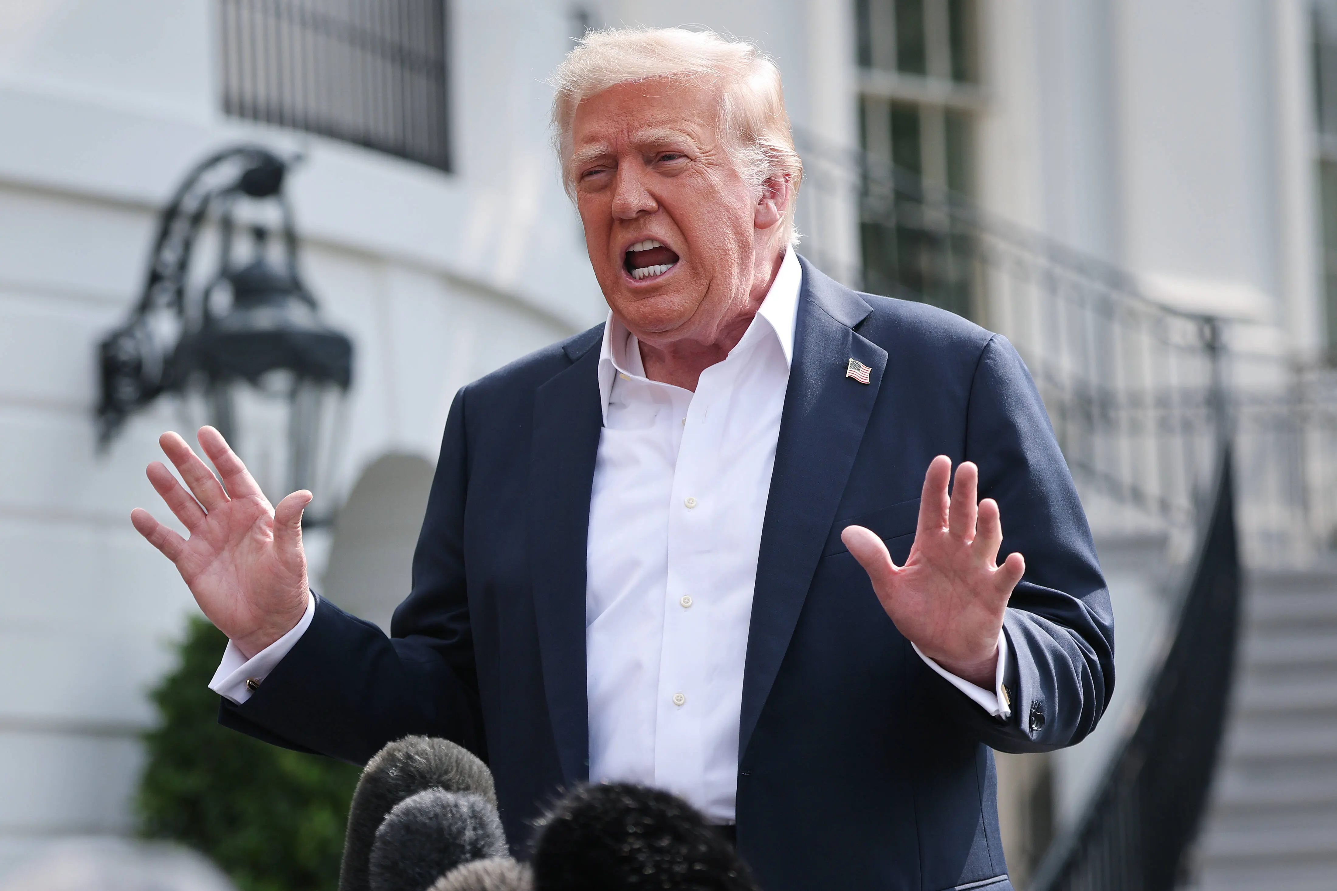 WASHINGTON, DC - JULY 11: U.S. President Donald Trump answers questions while departing the White House on July 11, 2025 in Washington, DC. Trump is scheduled to travel to Central Texas today to meet with first responders and local elected officials involved with the recovery process from last week's flash flooding event that has claimed more than 120 lives.  (Photo by Win McNamee/Getty Images)