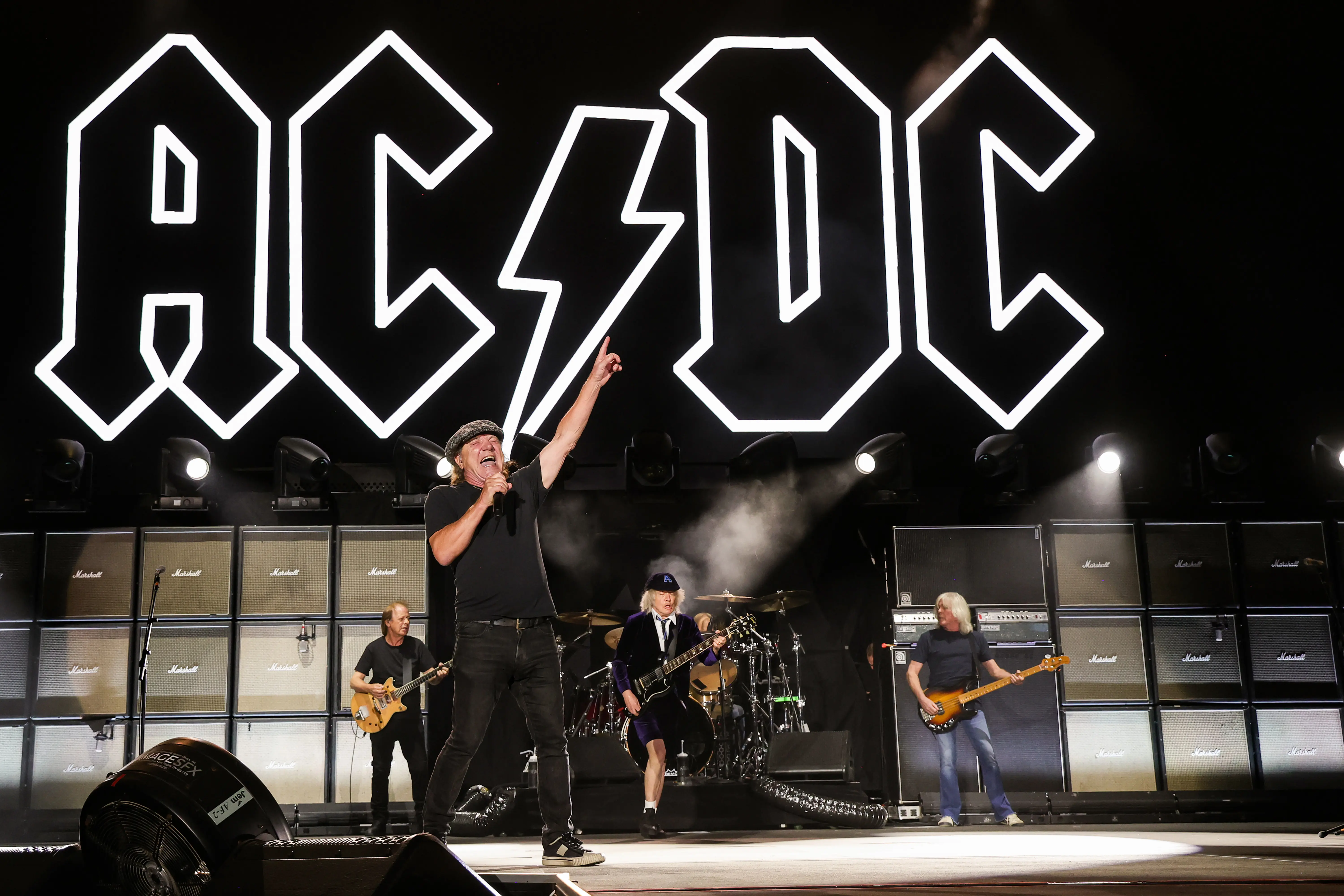 INDIO, CALIFORNIA - OCTOBER 07: (EDITORIAL USE ONLY) (L-R) Stevie Young, Brian Johnson, Angus Young, and Cliff Williams of AC/DC perform onstage during the Power Trip music festival at Empire Polo Club on October 07, 2023 in Indio, California. (Photo by Kevin Mazur/Getty Images for Power Trip)
