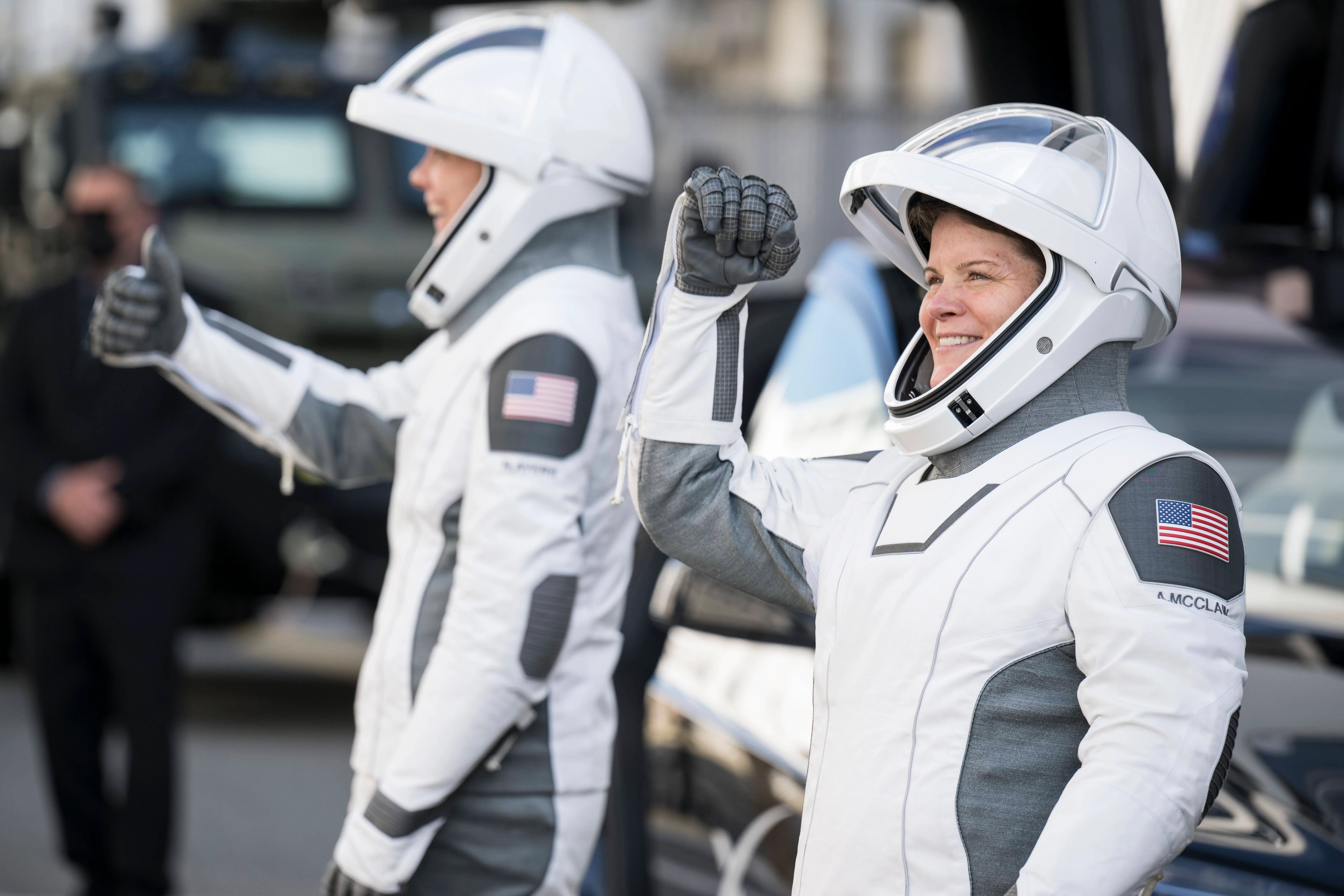 CAPE CANAVERAL, FL - MARCH 14: (EDITOR'S NOTE: This Handout image was provided by a third-party organization and may not adhere to Getty Images' editorial policy.) In this NASA handout, NASA astronauts Anne McClain, right, and Nichole Ayers gesture to friends and family as they prepare to depart the Neil A. Armstrong Operations and Checkout Building for Launch Complex 39A on NASA's Kennedy Space Center to board the SpaceX Dragon spacecraft for the Crew-10 mission launch, on March 14, 2025, at NASA's Kennedy Space Center in Florida. NASA's SpaceX Crew-10 mission is the tenth crew rotation mission of the SpaceX Crew Dragon spacecraft and Falcon 9 rocket to the International Space Station as part of the agency's Commercial Crew Program. McClain, Ayers, JAXA (Japan Aerospace Exploration Agency) astronaut Takuya Onishi, and Roscosmos cosmonaut Kirill Peskov, are scheduled to launch at 7:03 p.m. EDT, from Launch Complex 39A at the NASA's Kennedy Space Center. (Photo by Aubrey Gemignani/NASA via Getty Images)