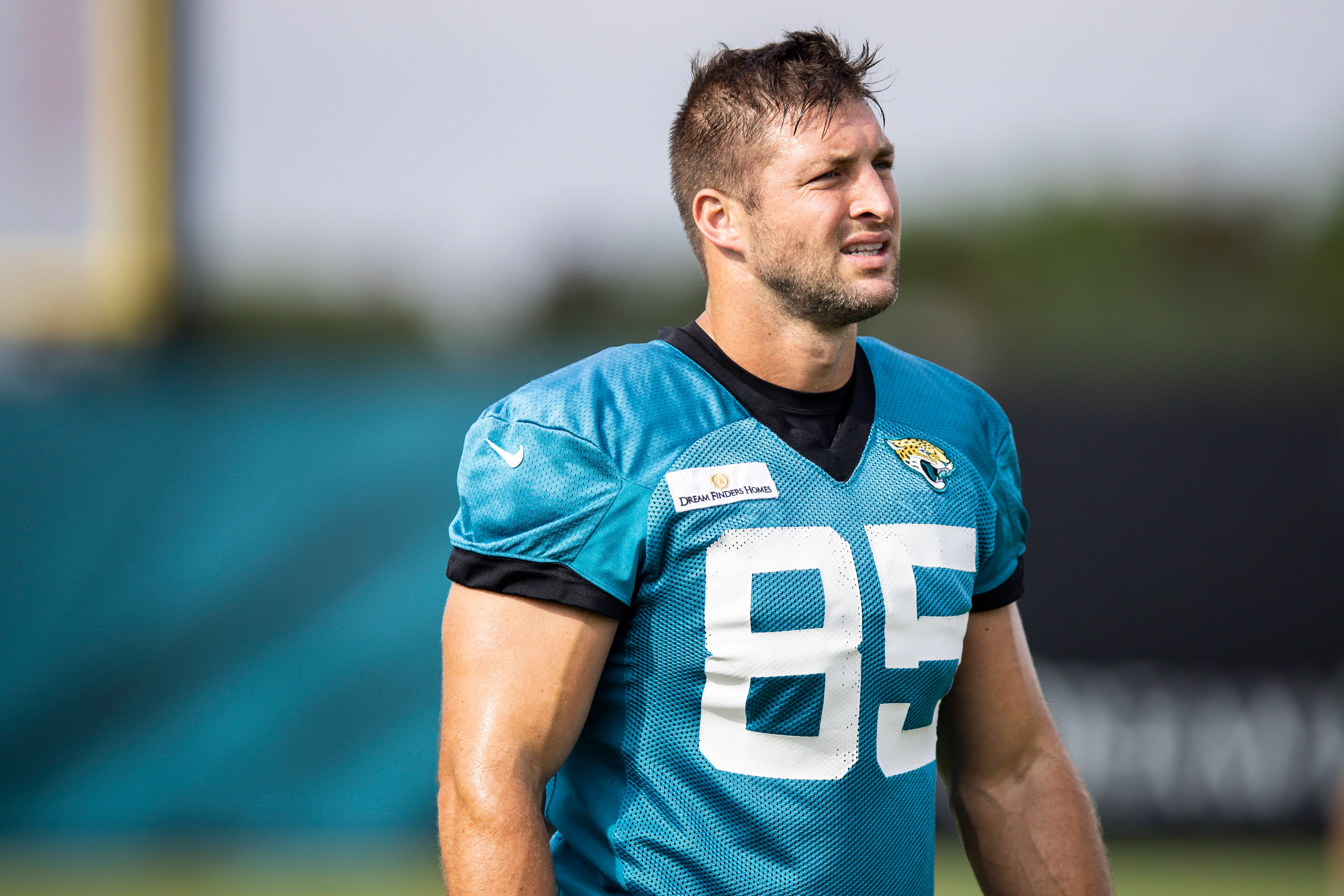 JACKSONVILLE, FLORIDA - JULY 30: Tim Tebow #85 of the Jacksonville Jaguars looks on during Training Camp at TIAA Bank Field on July 30, 2021 in Jacksonville, Florida. (Photo by James Gilbert/Getty Images)
