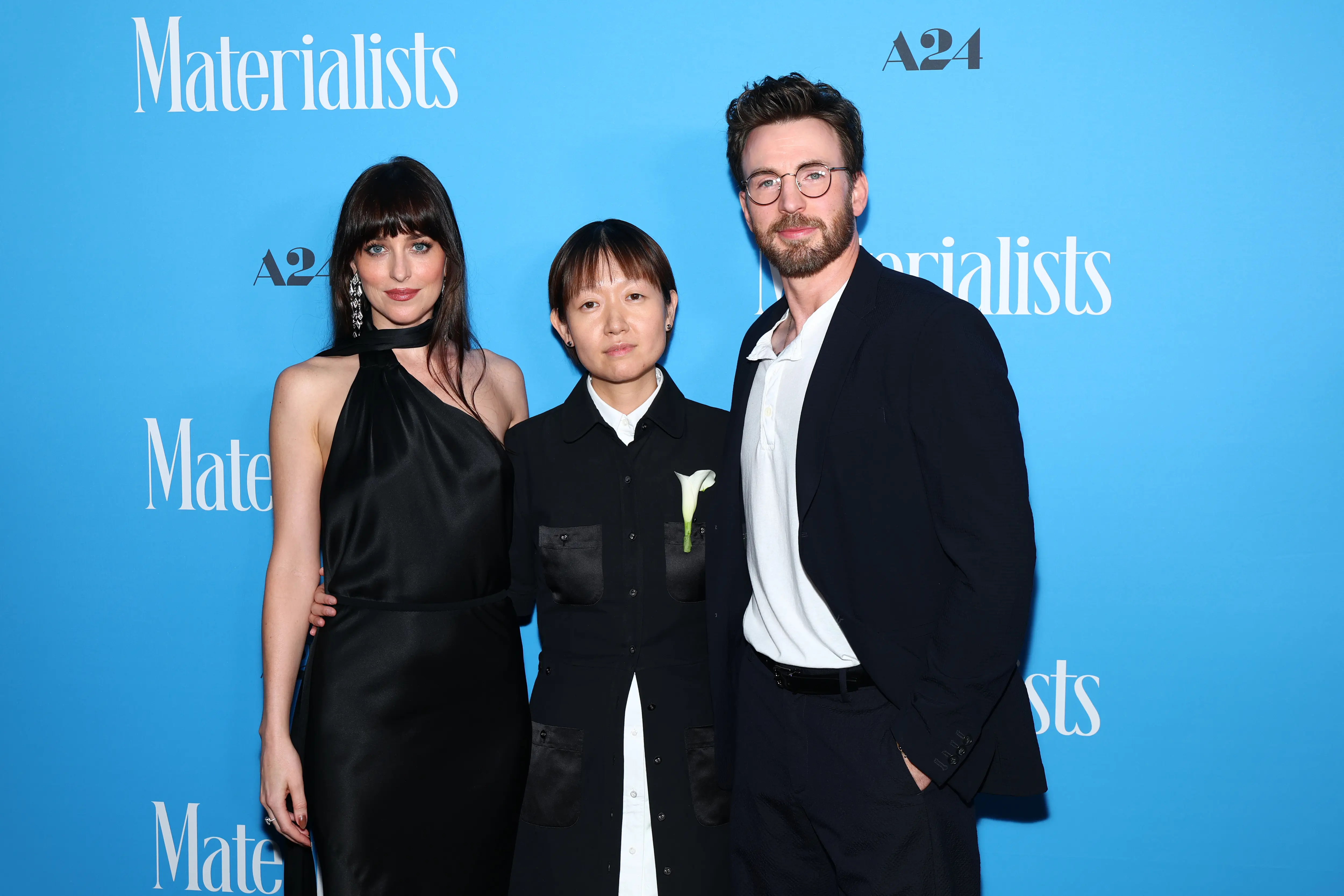 NEW YORK, NEW YORK - JUNE 07: (L-R) Dakota Johnson, Celine Song and Chris Evans attend A24's "Materialists" premiere at DGA Theater on June 07, 2025 in New York City. (Photo by Arturo Holmes/Getty Images)