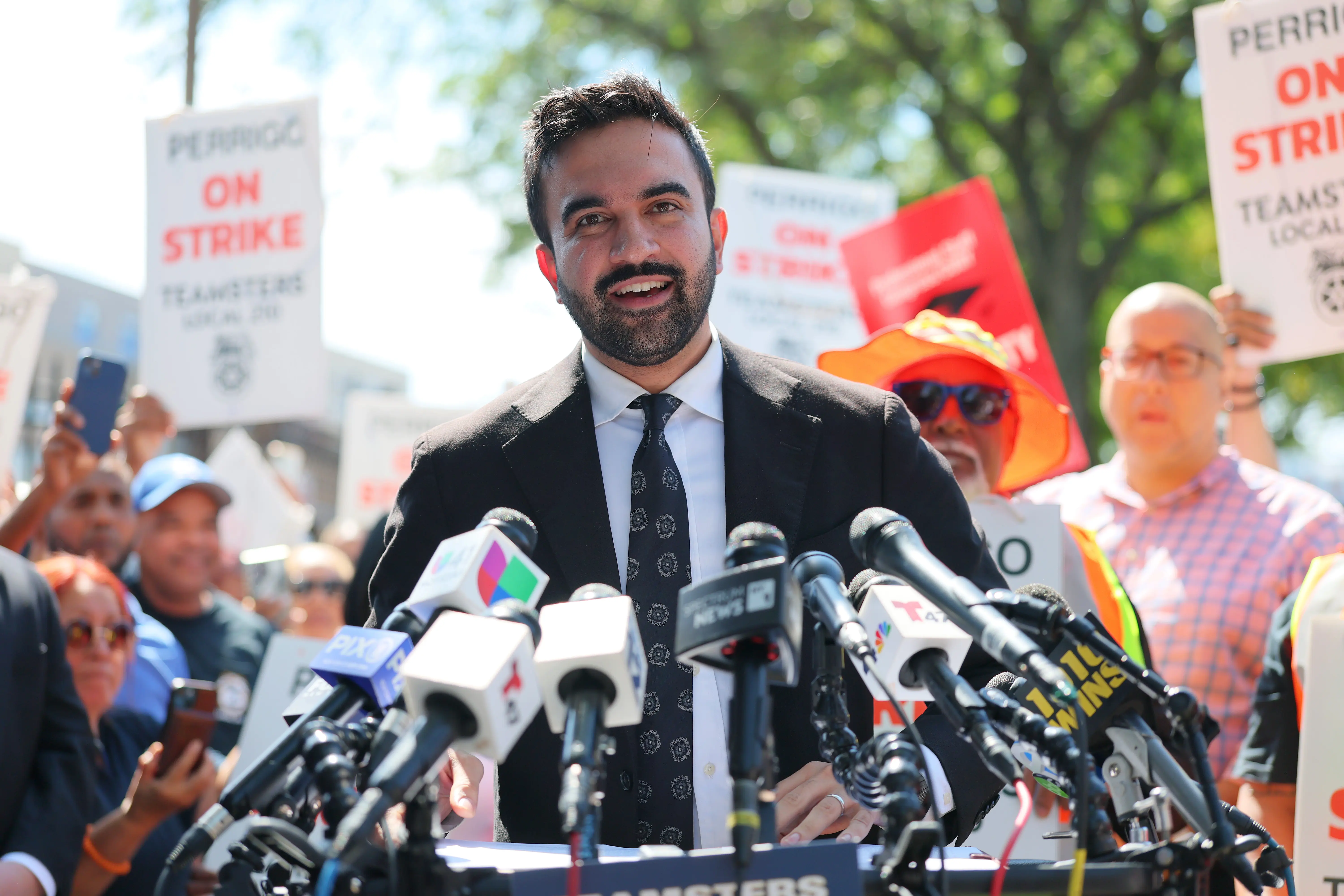 NEW YORK, NEW YORK - SEPTEMBER 15: New York mayoral candidate Zohran Mamdani speaks as he joins striking members of the Teamsters Local 210 outside of the Perrigo Company on September 15, 2025 in New York City. Zohran, Assemblymember Amanda Septimo and State Senator Rivera joined Teamsters Local 210 and 175 Perrigo workers who have been on strike since September 2 calling for fair pay, secure retirement funding, and protections against forced weekend work without overtime pay. (Photo by Michael M. Santiago/Getty Images)