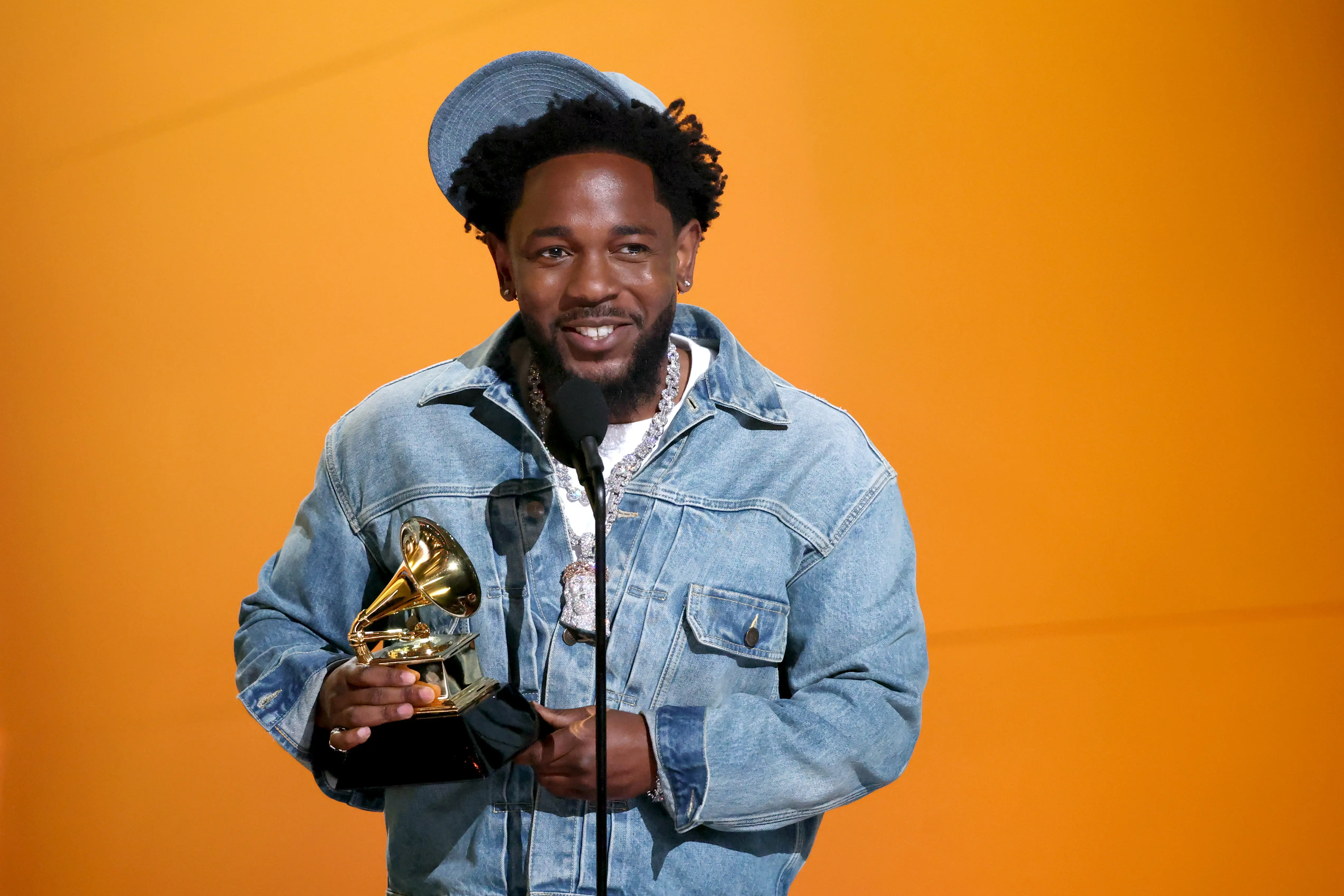 LOS ANGELES, CALIFORNIA - FEBRUARY 02: Kendrick Lamar accepts the Record of the Year award for "Not Like Us" onstage during the 67th Annual GRAMMY Awards at Crypto.com Arena on February 02, 2025 in Los Angeles, California.  (Photo by Kevin Mazur/Getty Images for The Recording Academy)