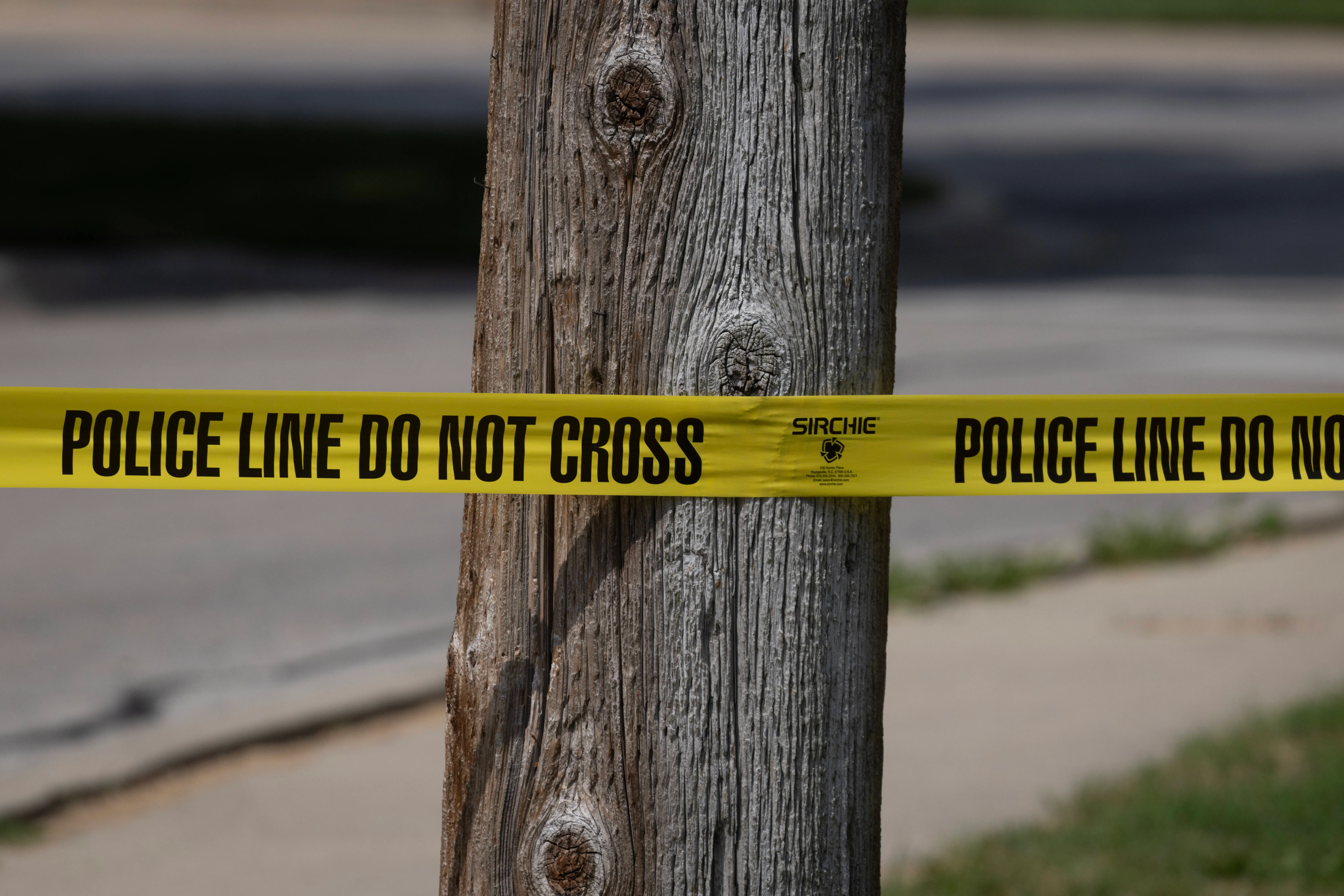 FRANKLIN PARK, ILLINOIS - SEPTEMBER 12: Police tape blocks off an area as investigators collect evidence after a man crashed his vehicle after being fatally shot during a confrontation with ICE officers on September 12, 2025 in Franklin Park, Illinois. The Chicago area has seen a surge in ICE activity recently, part of the Trump administration's crackdown on undocumented immigrants in the area dubbed "Operation Midway Blitz".    (Photo by Scott Olson/Getty Images)