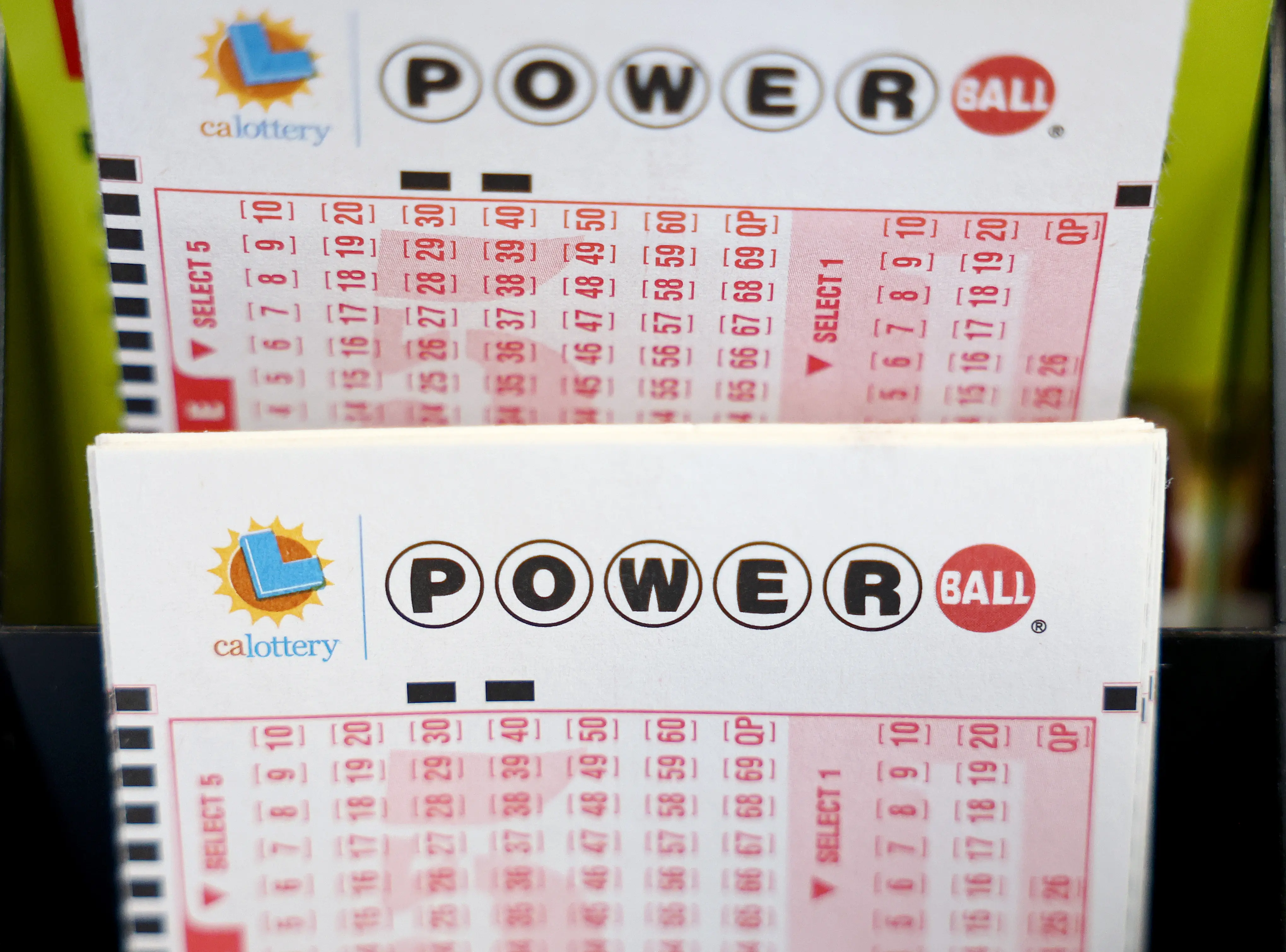 LOS ANGELES, CALIFORNIA - JULY 18: Powerball play slips are displayed in a convenience store on July 18, 2023 in Los Angeles, California. The Powerball jackpot for the drawing on July 19th is now estimated to be $1 billion after three months of drawings without a winner. (Photo by Mario Tama/Getty Images)