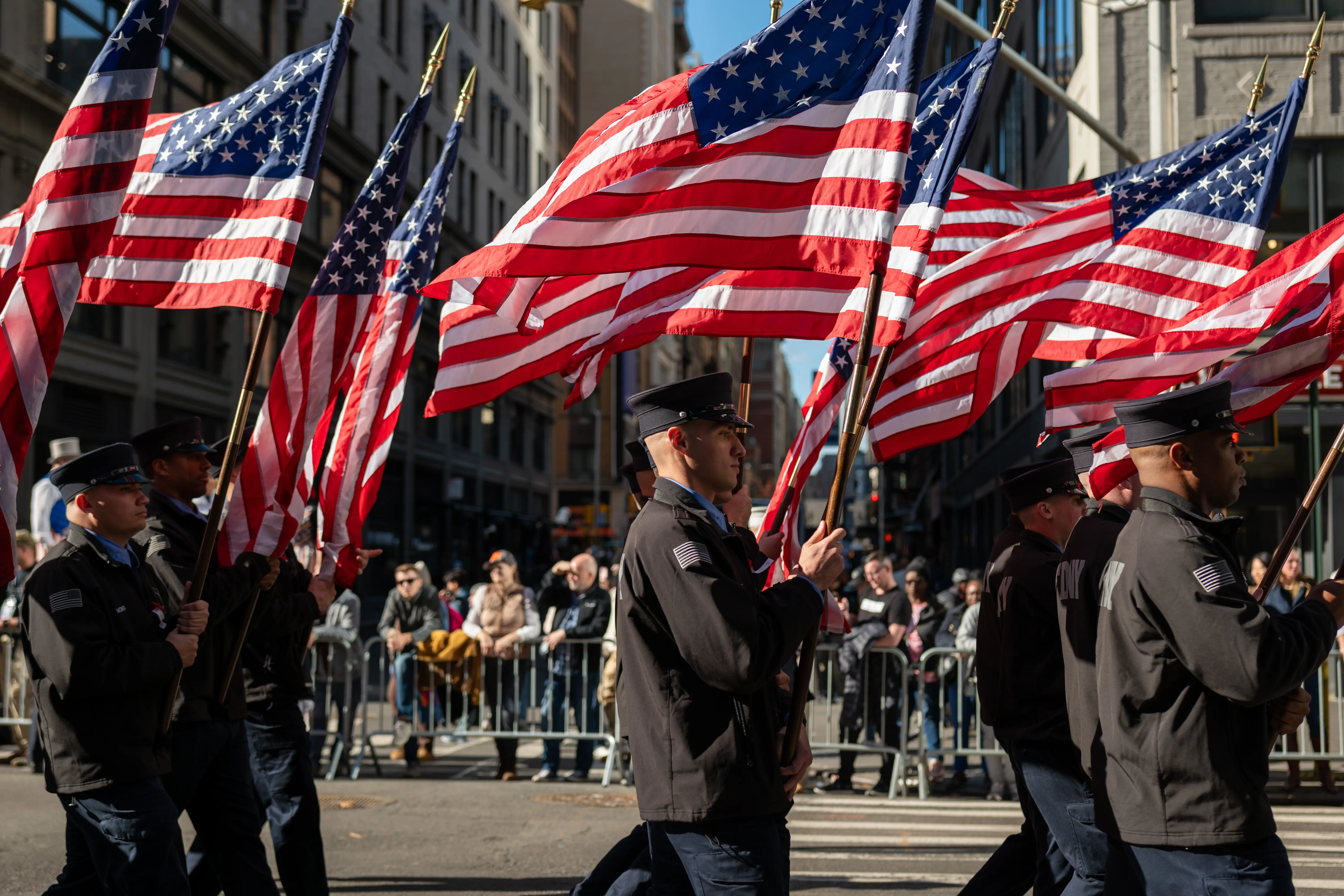 NEW YORK, NEW YORK - NOVEMBER 11: People participate in the 105th annual Veterans Day Parade on November 11, 2024, in New York City. Hundreds of people lined 5th Avenue to watch the biggest Veterans Day parade in the United States. This year's event included veterans, active soldiers, police officers, firefighters, and dozens of school groups participating in the parade, which honors the men and women who have served and sacrificed for the country.  (Photo by Spencer Platt/Getty Images)
