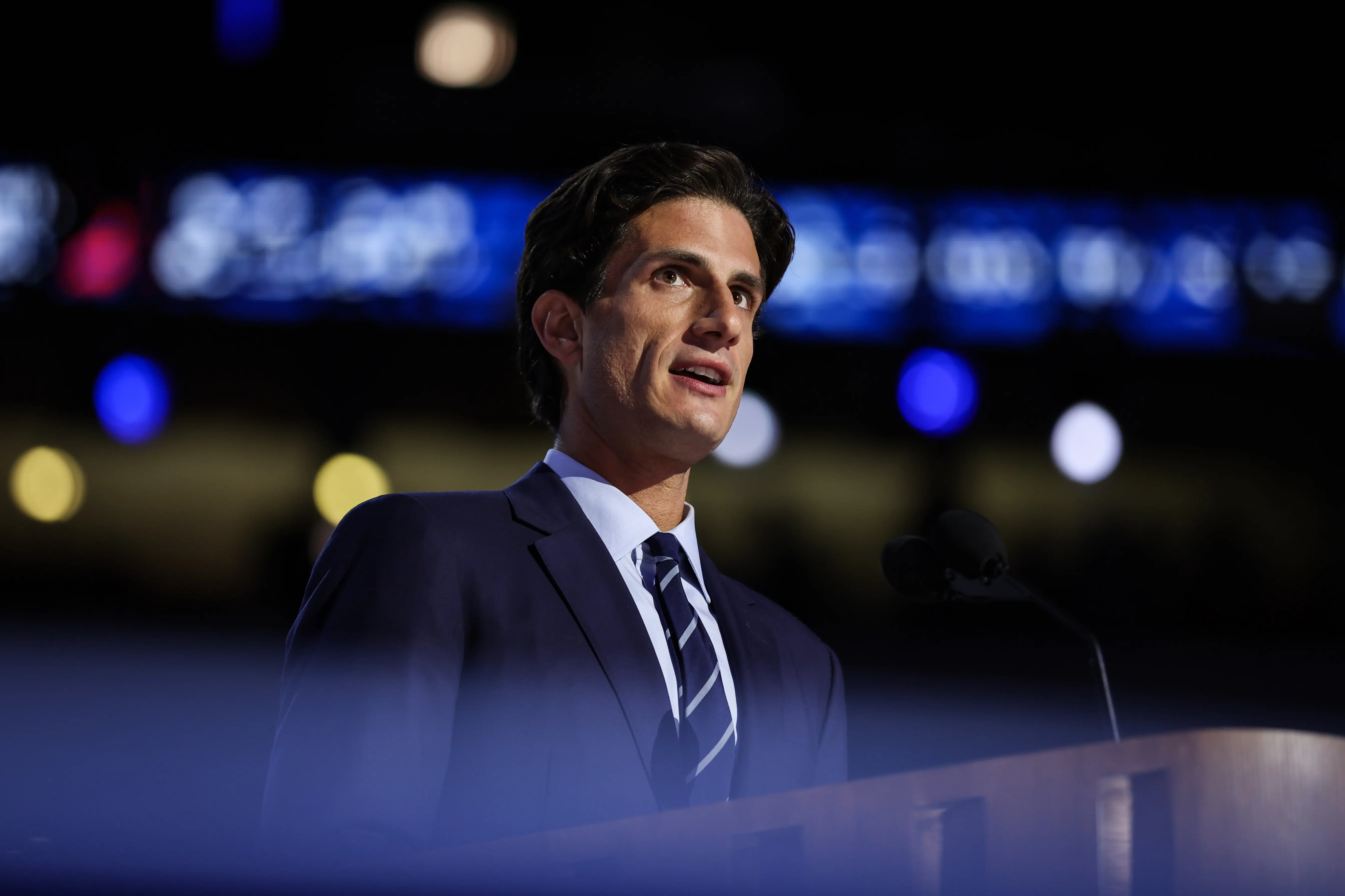 Jack Schlossberg, grandson of former U.S. President John F. Kennedy, speaks on stage (Image via Getty)