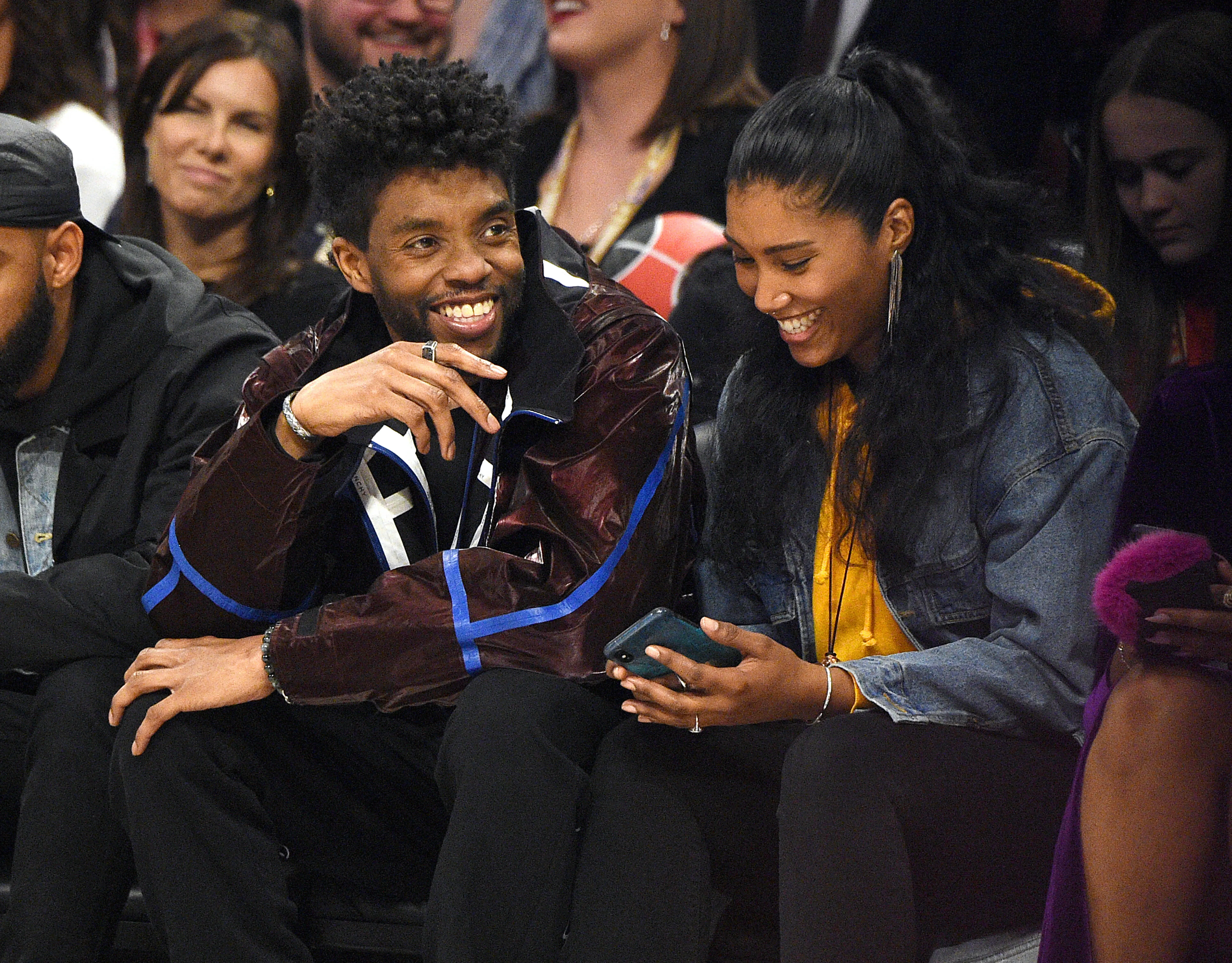 CHICAGO, ILLINOIS - FEBRUARY 16: Chadwick Boseman (L) and Taylor Simone Ledward attend the 69th NBA All-Star Game at United Center on February 16, 2020 in Chicago, Illinois. (Photo by Kevin Mazur/Getty Images)