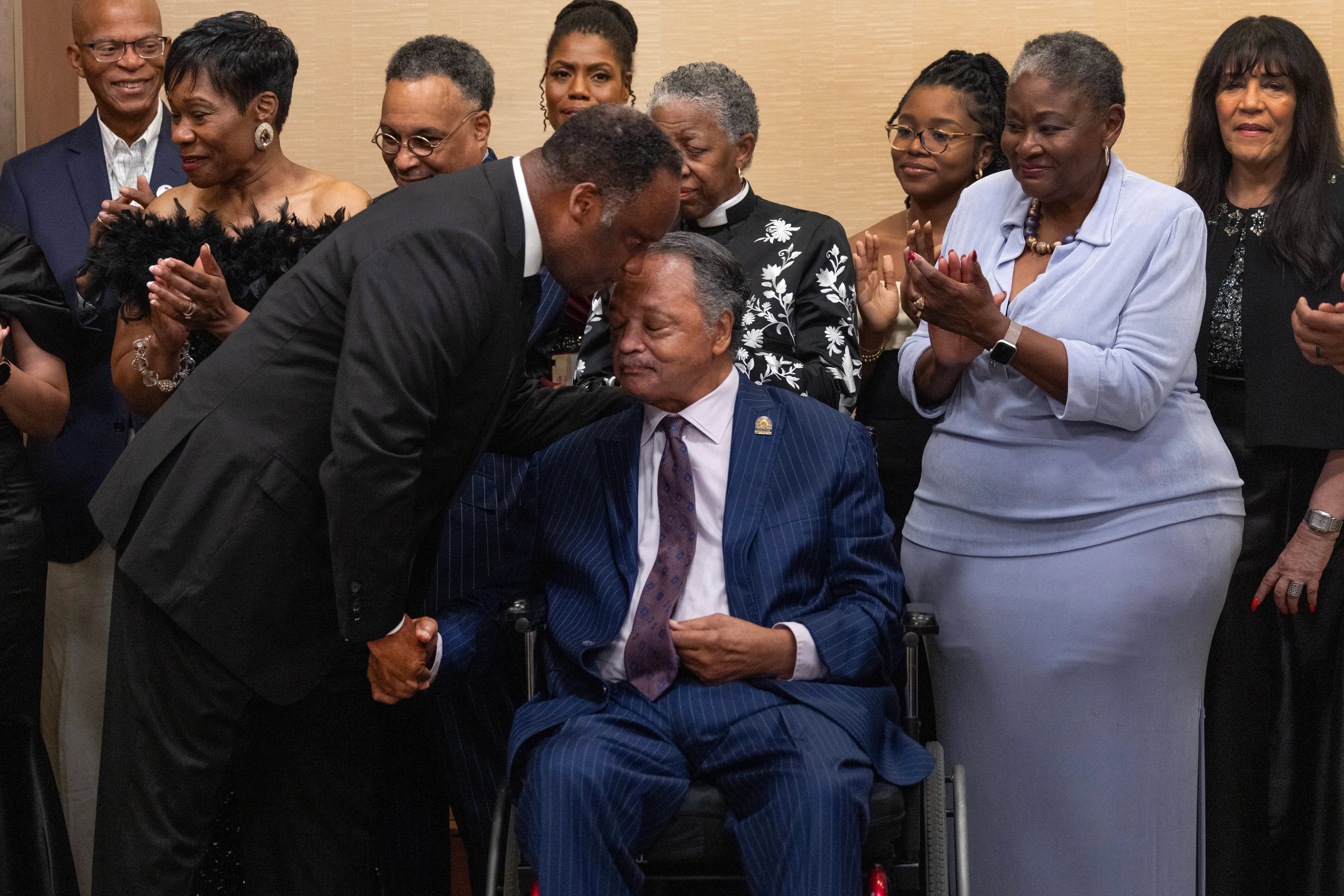 Civil Rights leader, the Rev. Jesse Jackson and his son U.S. Rep. Jonathan Jackson (D-IL) talk as they greet guests at the National Bar Association's annual convention on July 31, 2025 in Chicago, Illinois. The National Bar Association is the nation's oldest and largest network of predominately black legal professionals. Former President Joe Biden was scheduled to speak at the event's awards gala later in the evening. (Photo by Scott Olson/Getty Images)