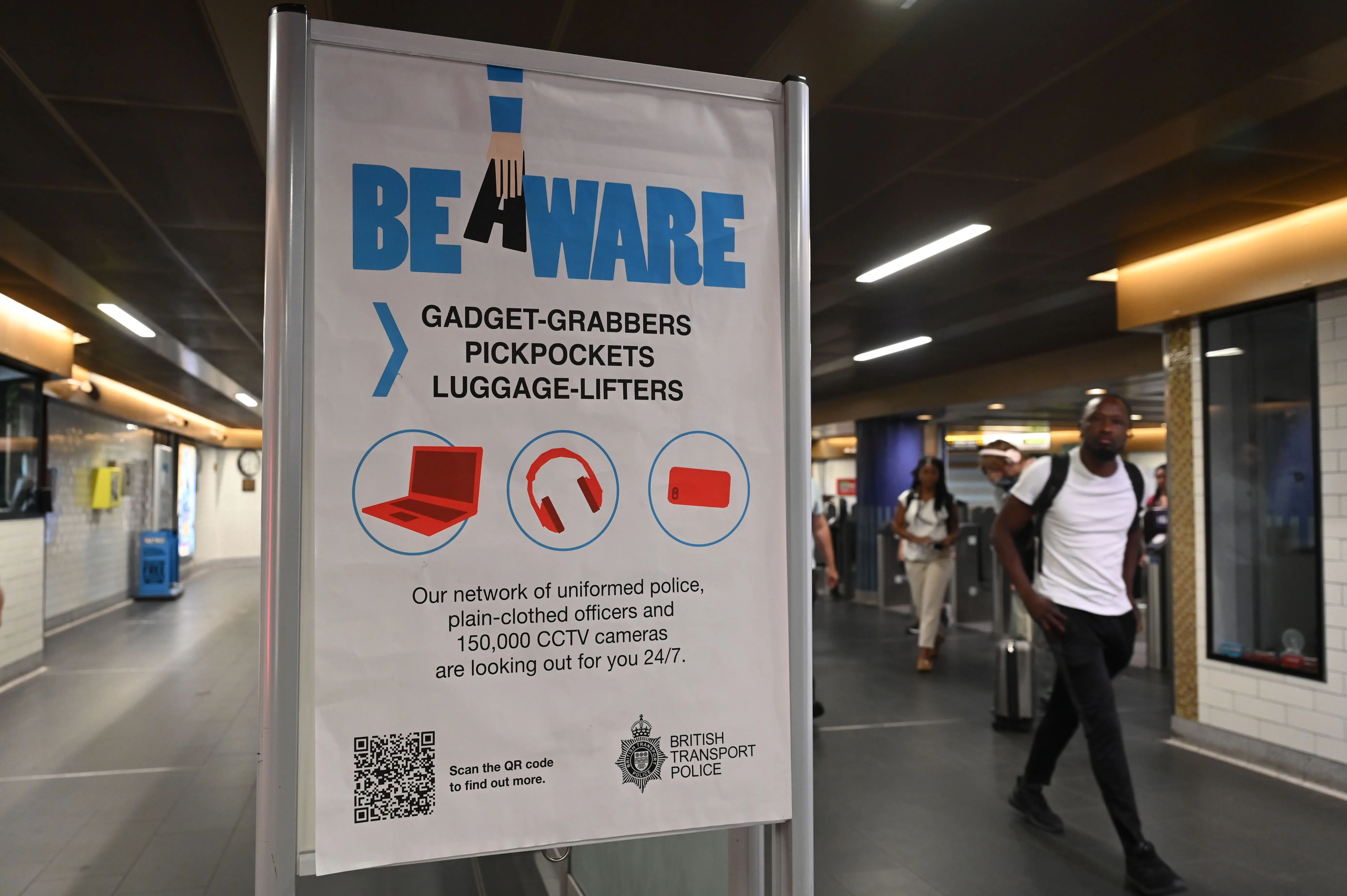 LONDON, UK - AUGUST 18: Warning signs placed at subway stations by the British Transport Police informing passengers to be cautious against pickpockets and electronic device thieves in London, United Kingdom on August 18, 2025. (Photo by Rasid Necati Aslim/Anadolu via Getty Images)