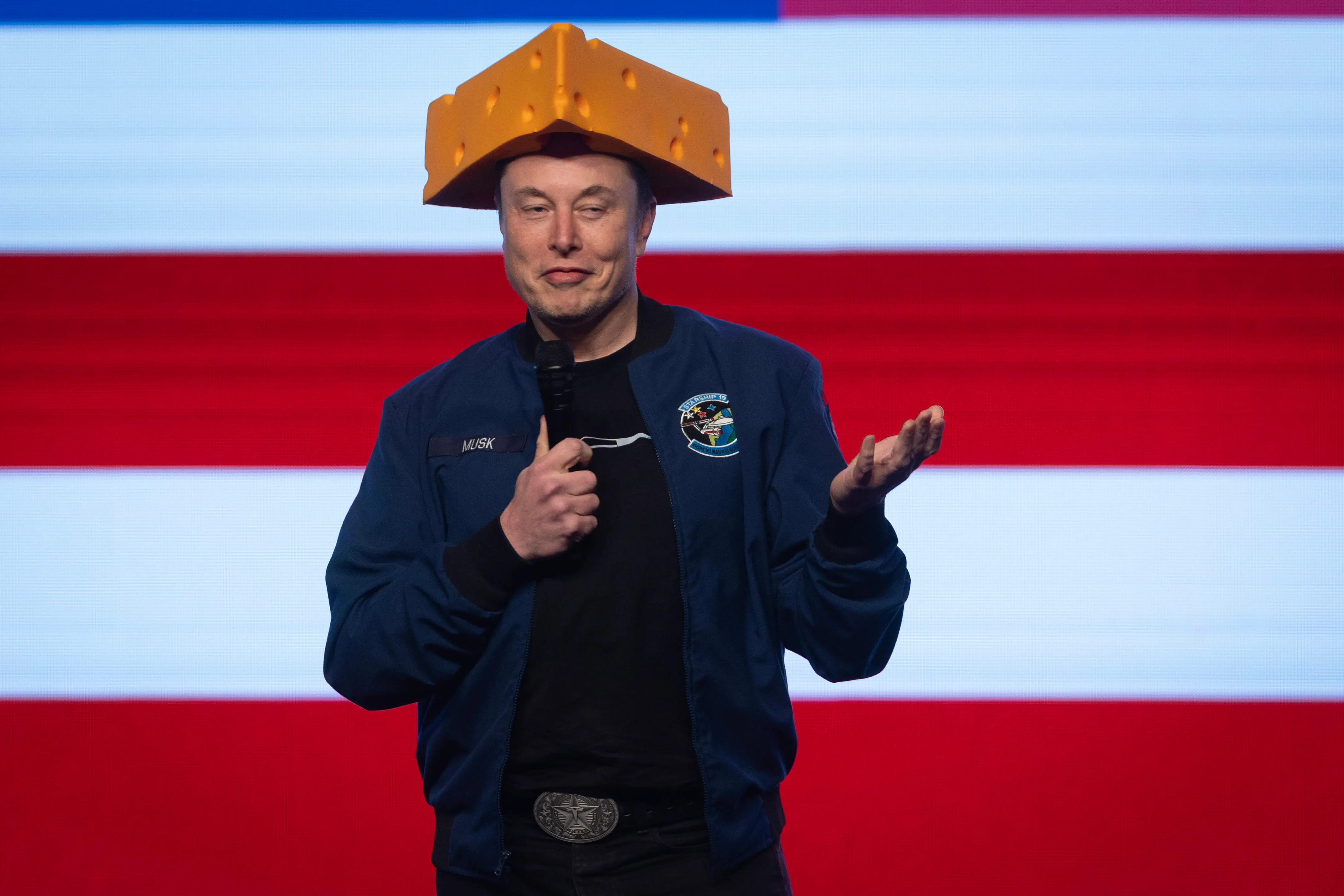 GREEN BAY, WISCONSIN - MARCH 30: Billionaire businessman Elon Musk arrives for a town hall wearing a cheesehead hat at the KI Convention Center on March 30, 2025 in Green Bay, Wisconsin. The town hall is being held in front of the state’s high-profile Supreme Court election between Circuit Court Judge Brad Schimel, who has been financially backed by Musk and endorsed by President Donald Trump, and Dane County Circuit Court Judge Susan Crawford. (Photo by Scott Olson/Getty Images)