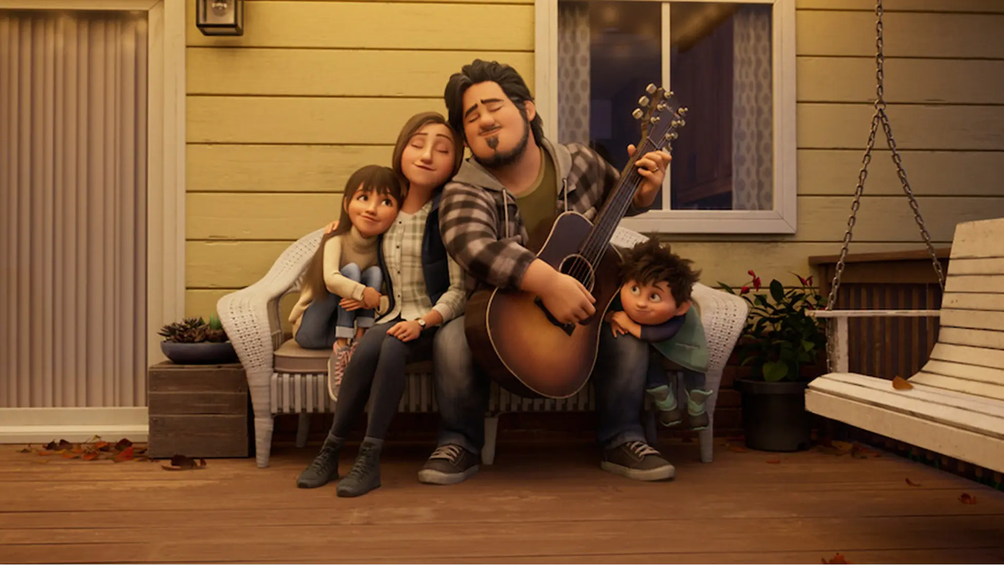 Stevie and Elliot share a quiet porch moment with their parents as Dad plays guitar, a warm family snapshot from In Your Dreams. Image via Netflix.