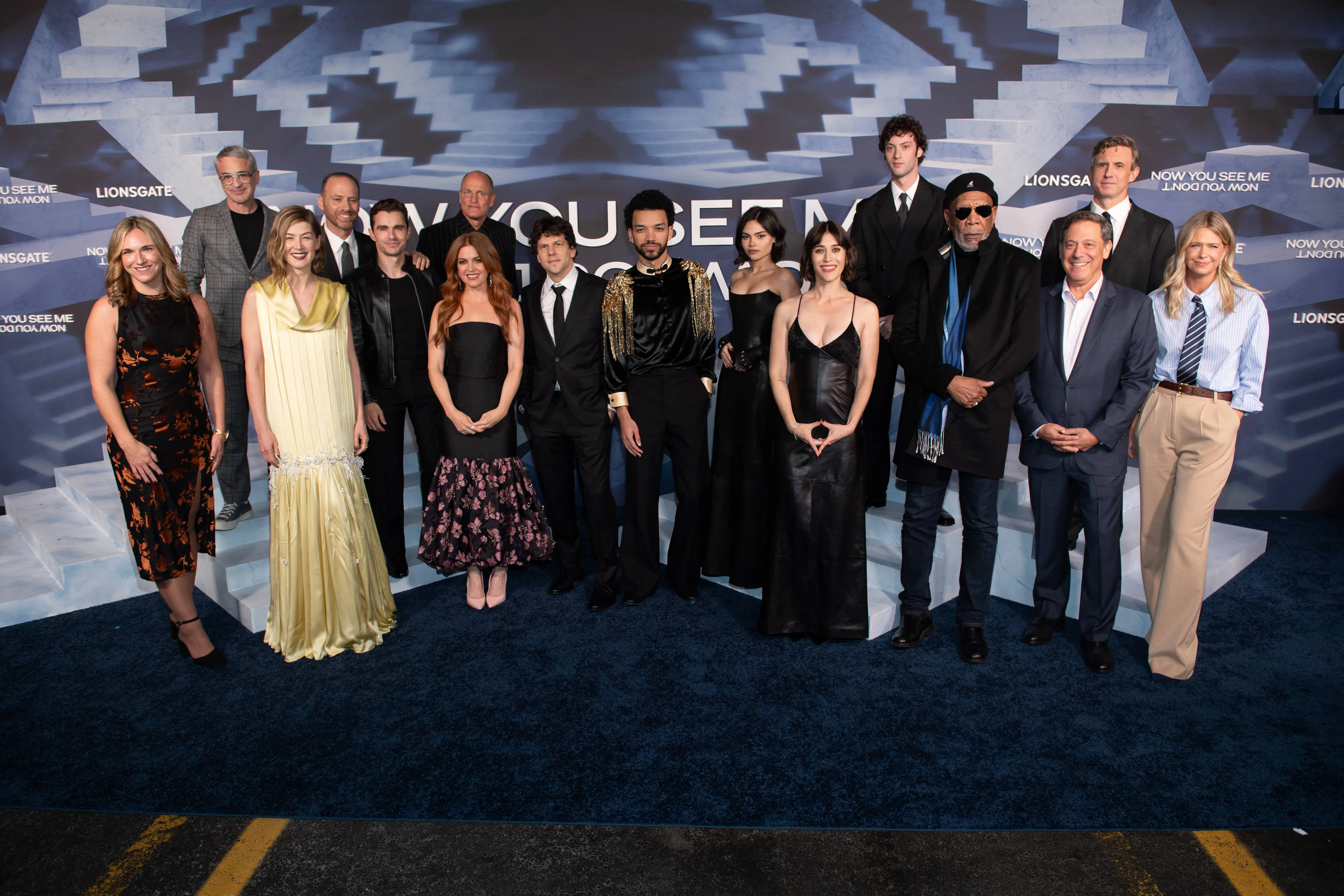 NEW YORK, NEW YORK - NOVEMBER 10: Meredith Wieck, Alex Kurtzman, Rosamund Pike, Bobby Cohen, Dave Franco, Woody Harrelson, Isla Fisher, Jesse Eisenberg, Justice Smith, Ariana Greenblatt, Lizzy Caplan, Dominic Sessa, Morgan Freeman, Adam Fogelson, Ruben Fleischer and Erin Westerman attend Lionsgate's "Now You See Me: Now You Don't" New York premiere at The Lighthouse at Chelsea Piers on November 10, 2025 in New York City. (Photo by Noam Galai/WireImage)