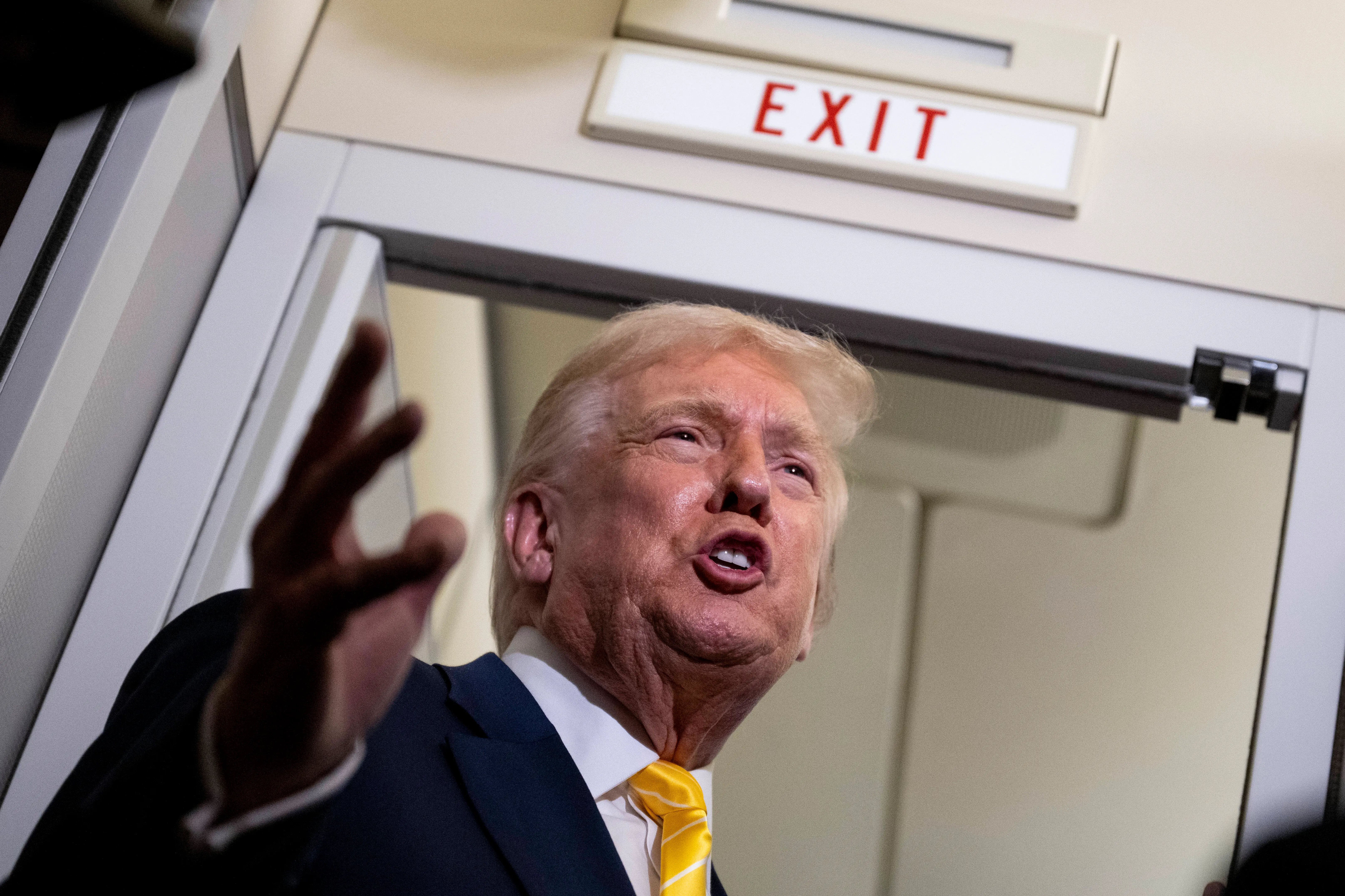U.S. President Donald Trump speaks to members of press aboard Air Force One on November 14, 2025 while in flight from Washington, DC to West Palm Beach International Airport. Trump is scheduled to spend the weekend at his Mar-A-Lago estate in Palm Beach, Florida. (Photo by Roberto Schmidt/Getty Images)