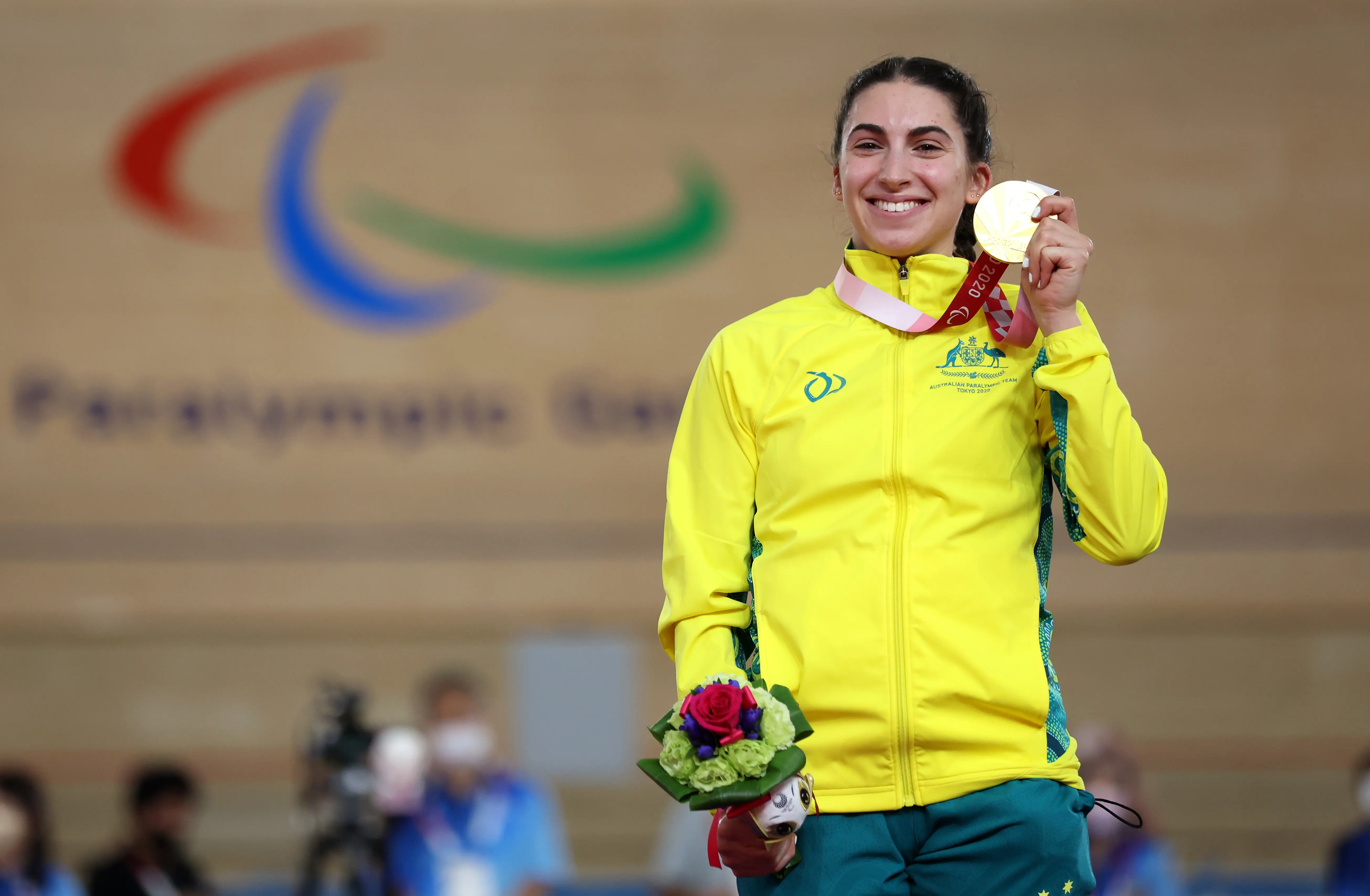 Paige Greco initially tried running before she started cycling (Image via Getty)