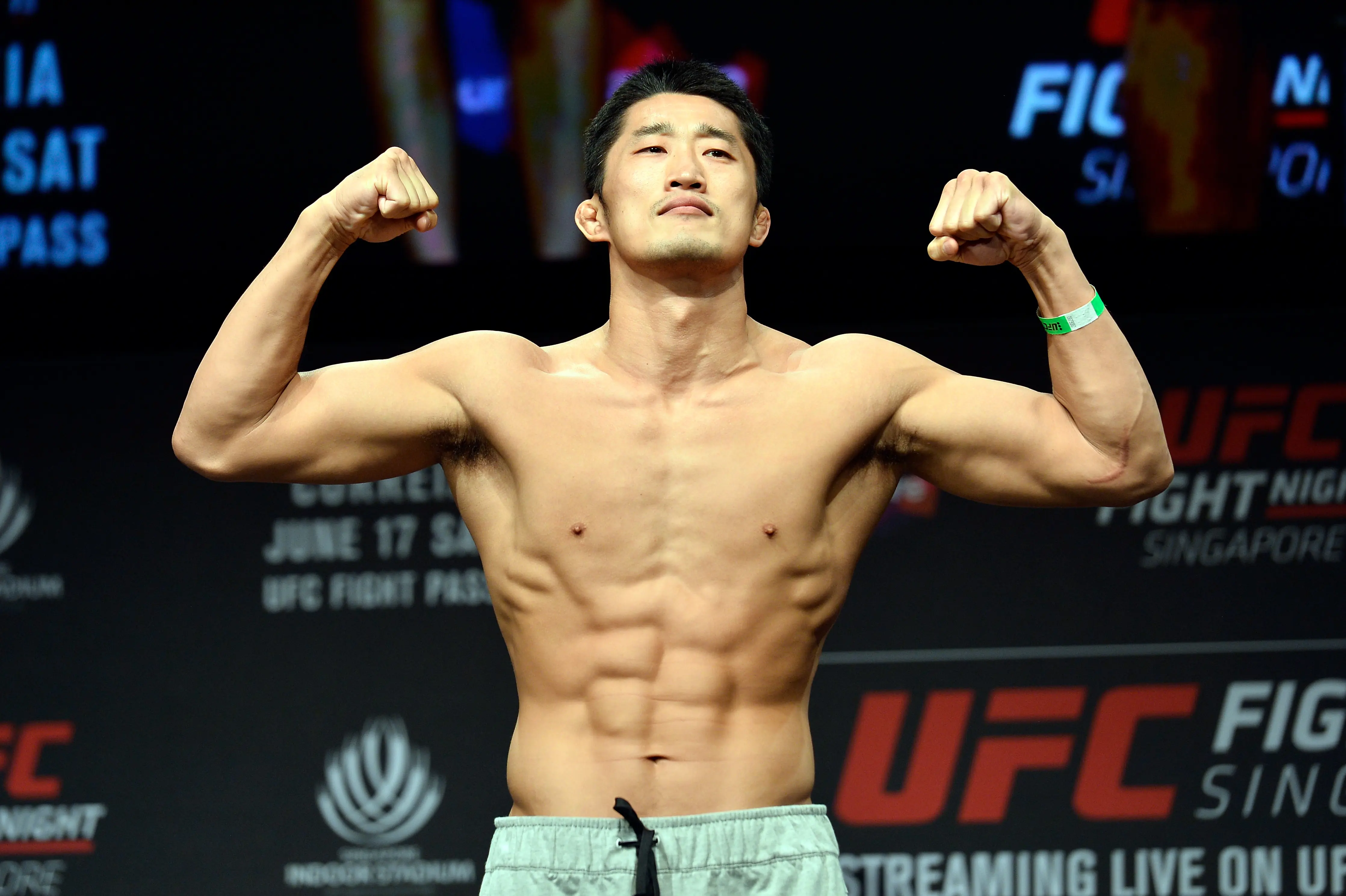 Dong Hyun Kim of South Korea poses on the scale during the UFC Fight Night weigh-in (Image via Getty)