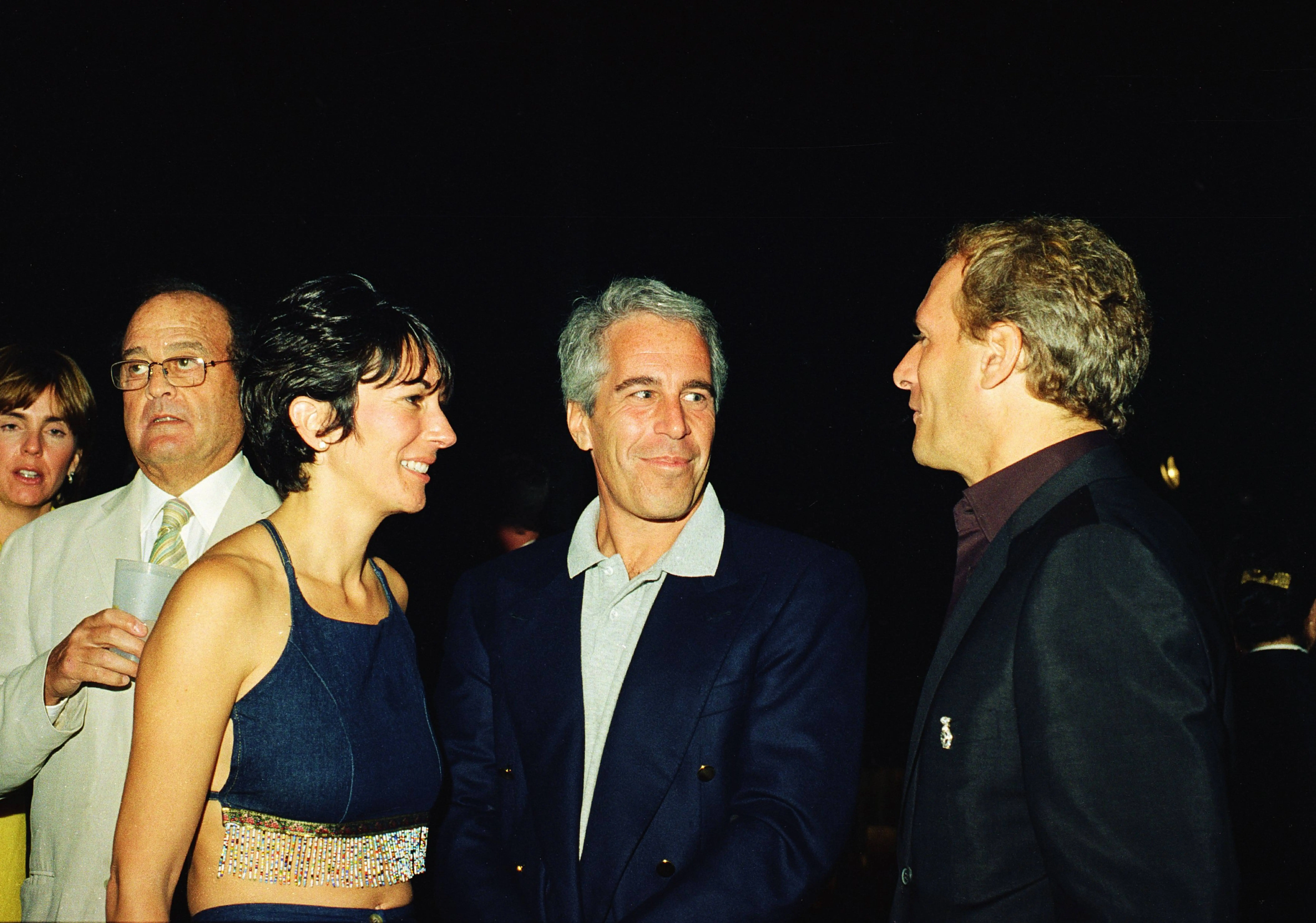 (L-R) Ghislaine Maxwell, Jeffrey Epstein, and musician Michael Bolton pose for a portrait during a party at the Mar-a-Lago club, Palm Beach, Florida, February 12, 2000. (Photo by Davidoff Studios/Getty Images)