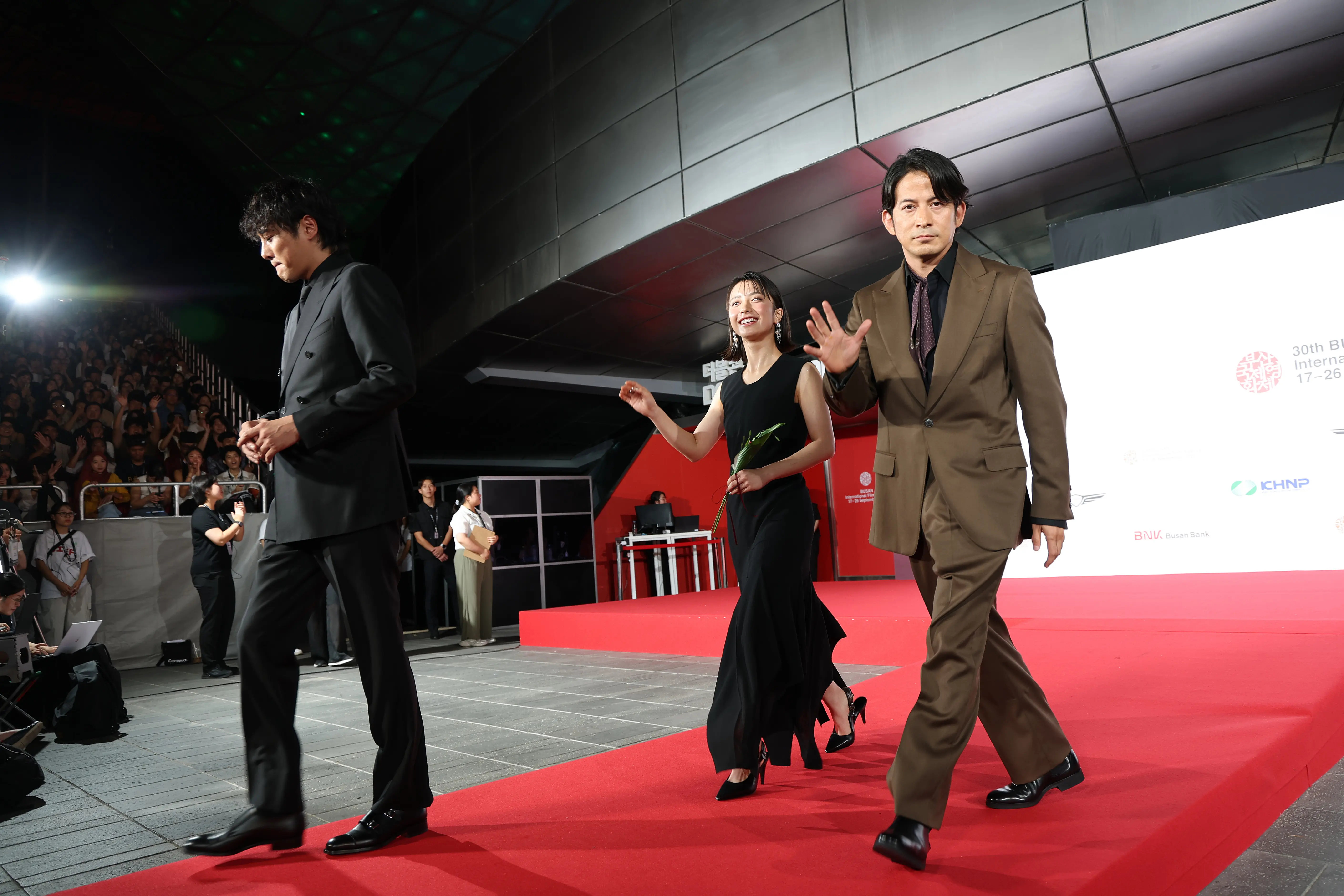 Junichi Okada, Yumia Fujisaki and Michihito Fujii of Netflix's series “Last Samurai Standing” attend the opening ceremony during the 30th Busan International Film Festival at the Busan Cinema Center on September 17, 2025 in Busan, South Korea. (Photo by Chung Sung-Jun/Getty Images)
