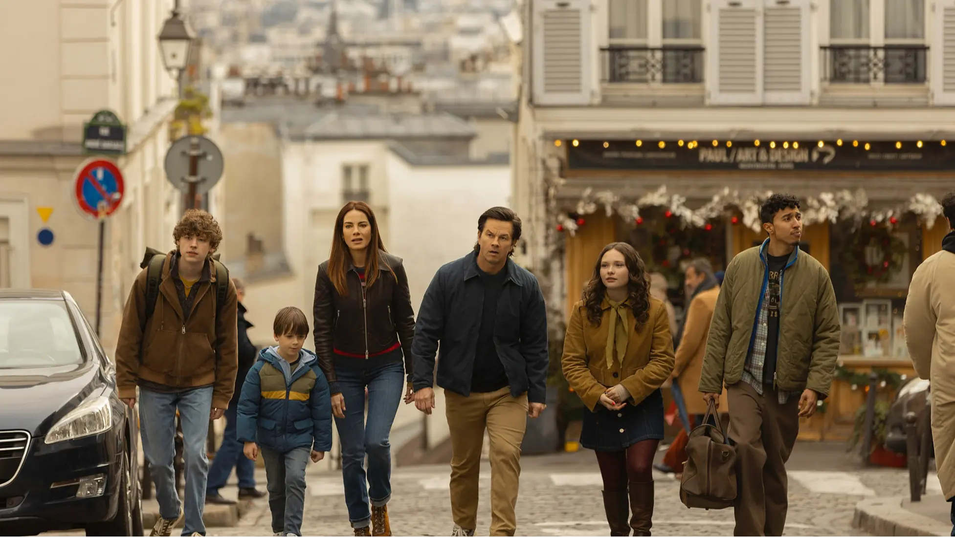 Van Crosby, Peter Lindsey, Michelle Monaghan, Mark Wahlberg, Zoe Colletti and Reda Elazouar in The Family Plan 2, premiering November 21, 2025 on Apple TV. (Image via Apple TV+)