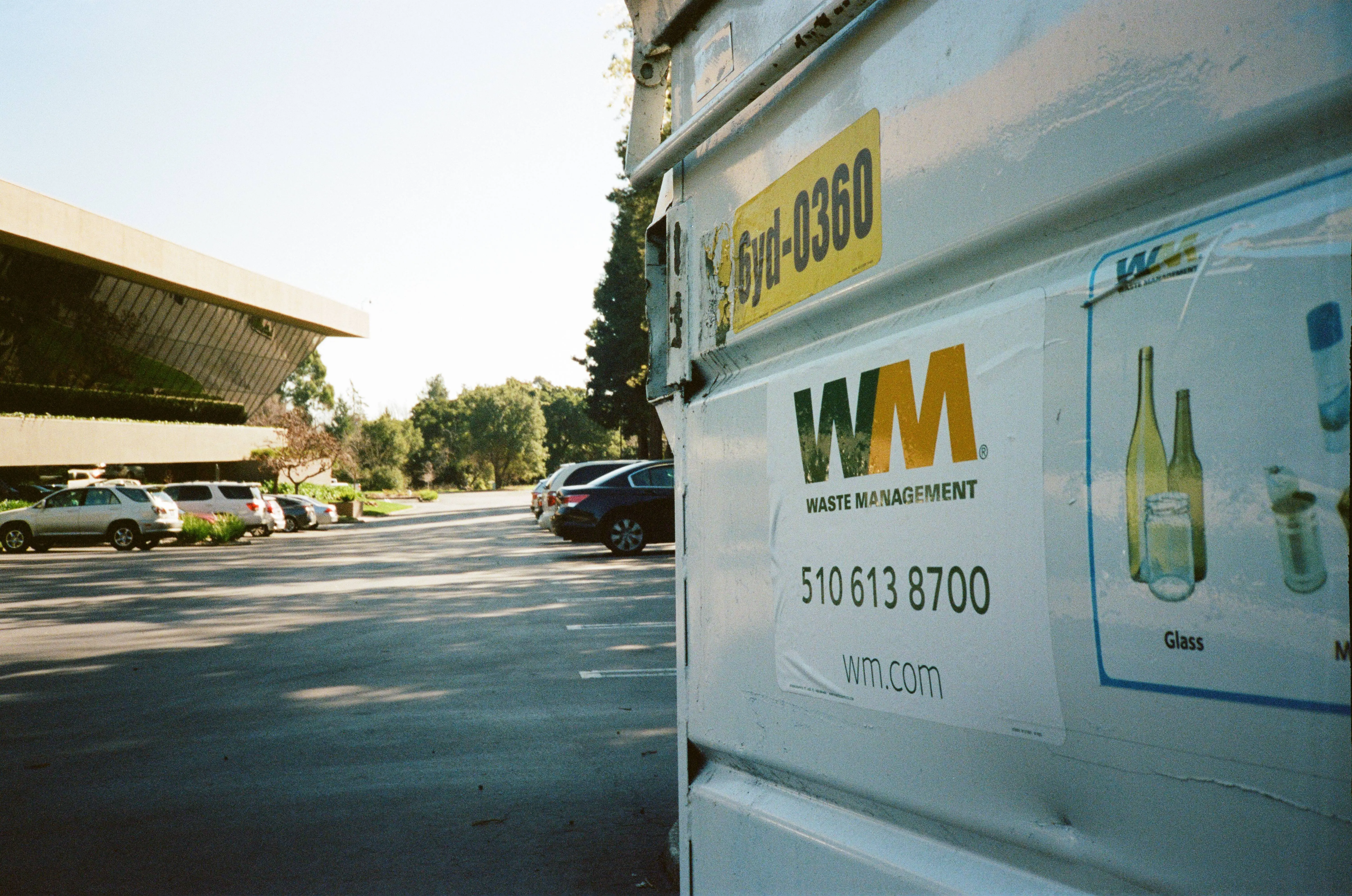 Low-angle view of Waste Management dumpster with recycling prompts in a parking lot at a facility in San Ramon, California, February 7, 2018. Waste Management ranked 201 in the 2017 Fortune 500 list. (Photo by Smith Collection/Gado/Getty Images)