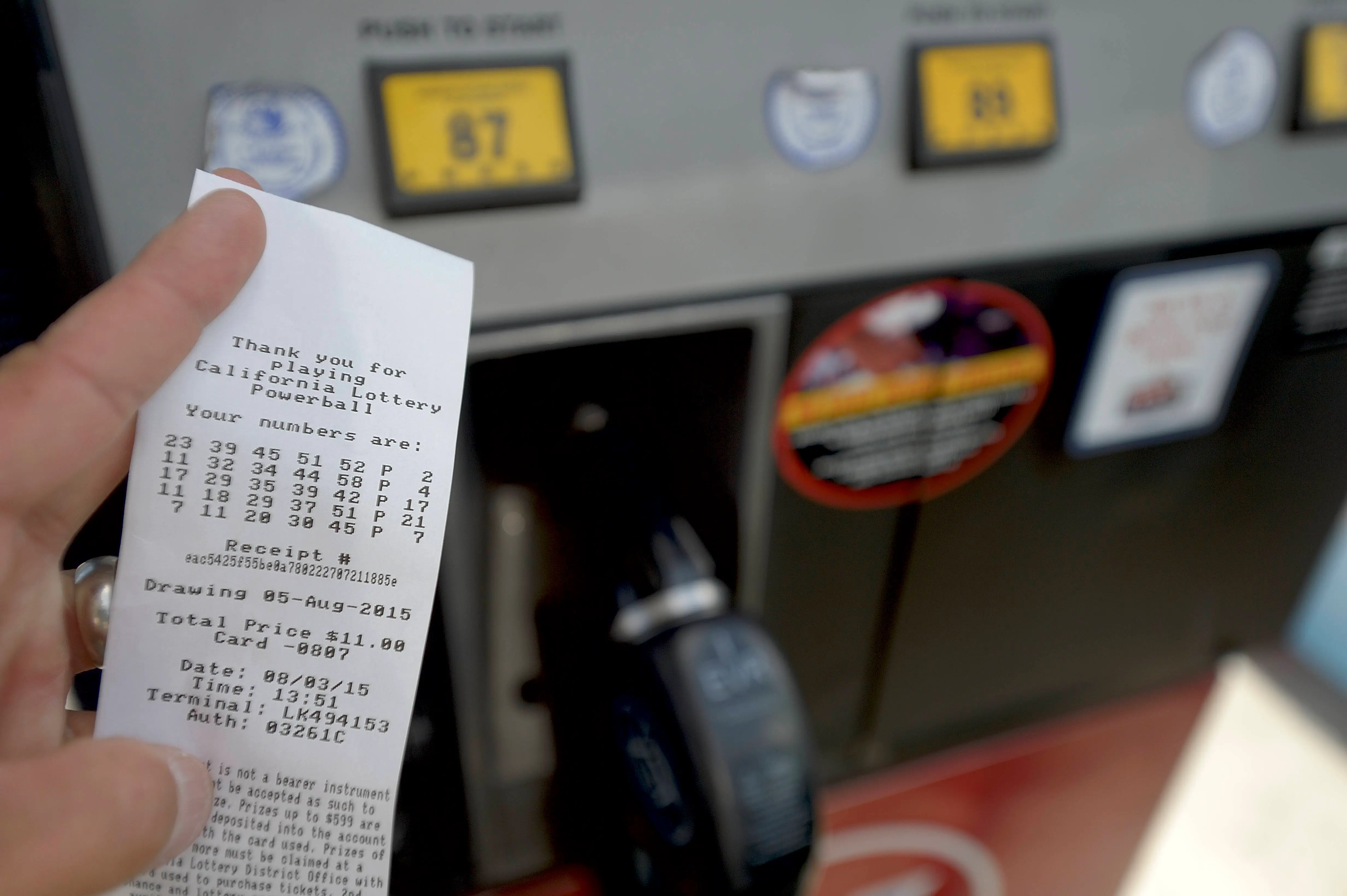 SANTA ANA, CA - AUGUST 03: A gas pump receipt shows lotto numbers purchased at the pump while buying gas at Edinger 76 in Santa Ana.The California Lottery's Powerball, SuperLotto and Mega Millions are now available at some gas pumps in Orange County including Edinger 76 in Santa Ana.///ADDITIONAL INFORMATION: Slug: fairyshrimp.1010.jag, Day: Monday, August 3, 2015 (8/3/15), Time: 1:52:44 PM, Location:  Santa Ana, California - Gas Pump Lotto  - JEFF GRITCHEN, STAFF PHOTOGRAPHER(Photo by Jeff Gritchen/Digital First Media/Orange County Register via Getty Images)
