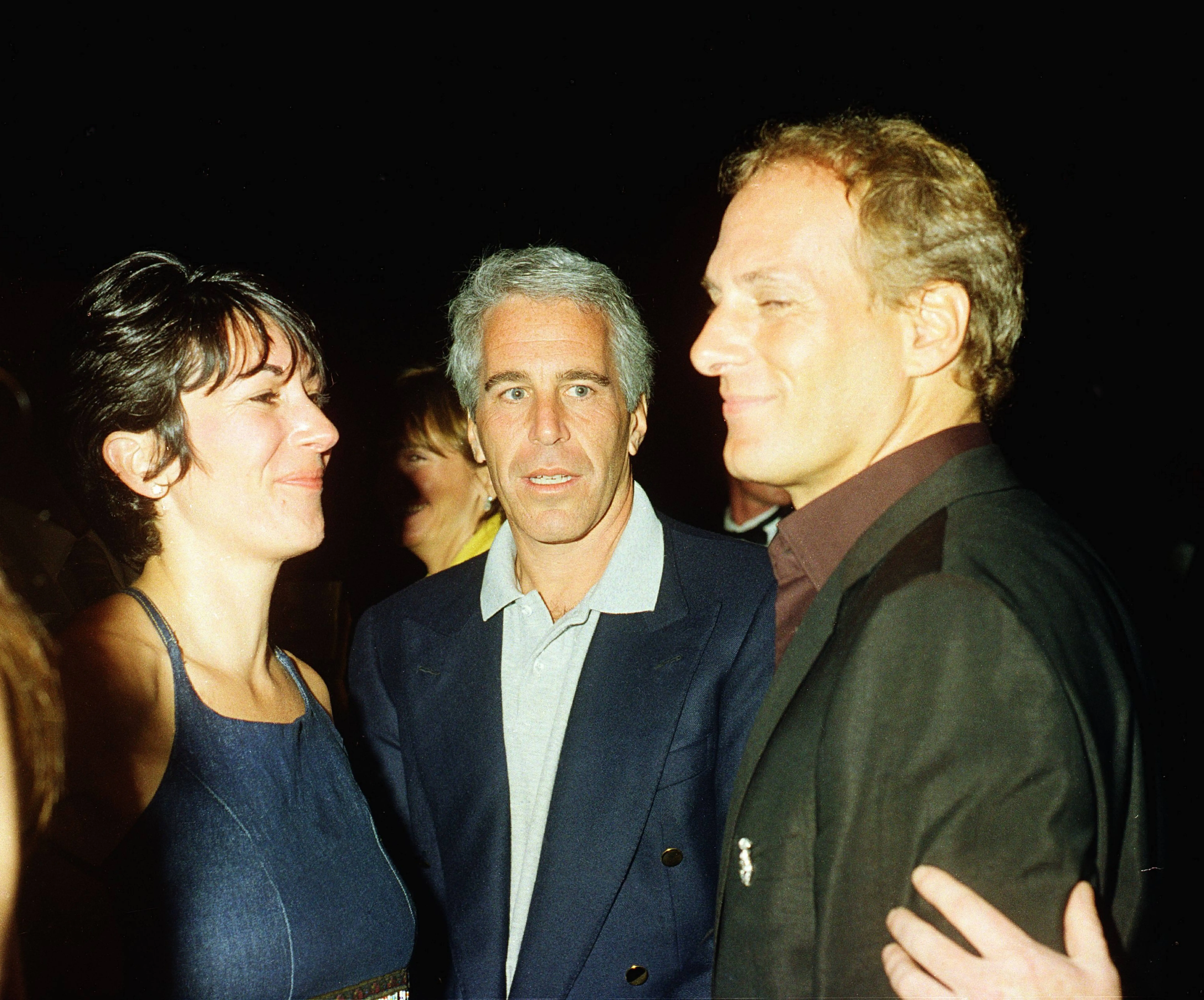 (L-R) Ghislaine Maxwell, Jeffrey Epstein and musician Michael Bolton pose for a portrait during a party at the Mar-a-Lago club, Palm Beach, Florida, February 12, 2000. (Photo by Davidoff Studios/Getty Images)