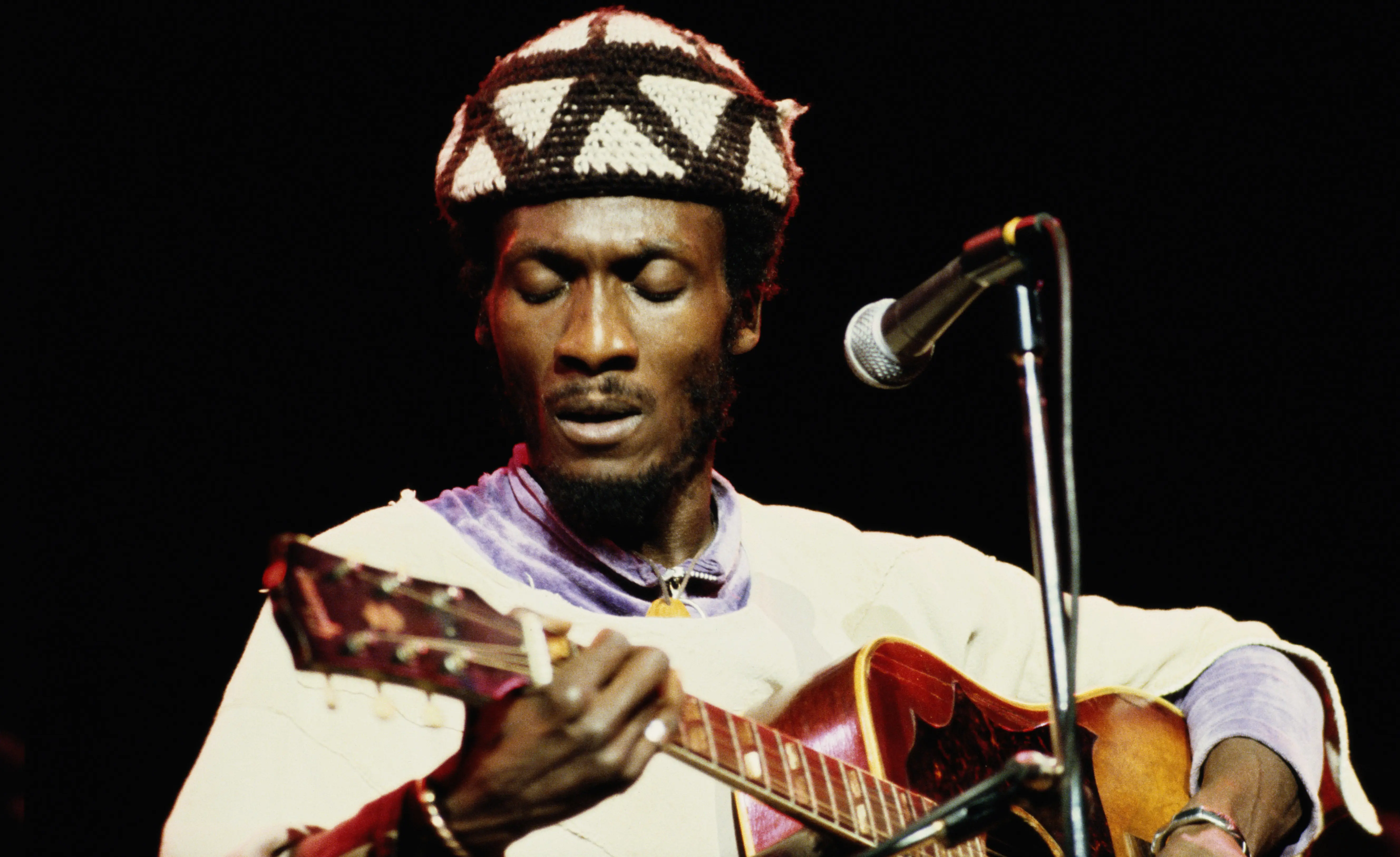 LONDON: Jamaican reggae singer Jimmy Cliff performs on stage at the Hammersmith Odeon, London in November 1978. (Photo by David Redfern/Redferns)