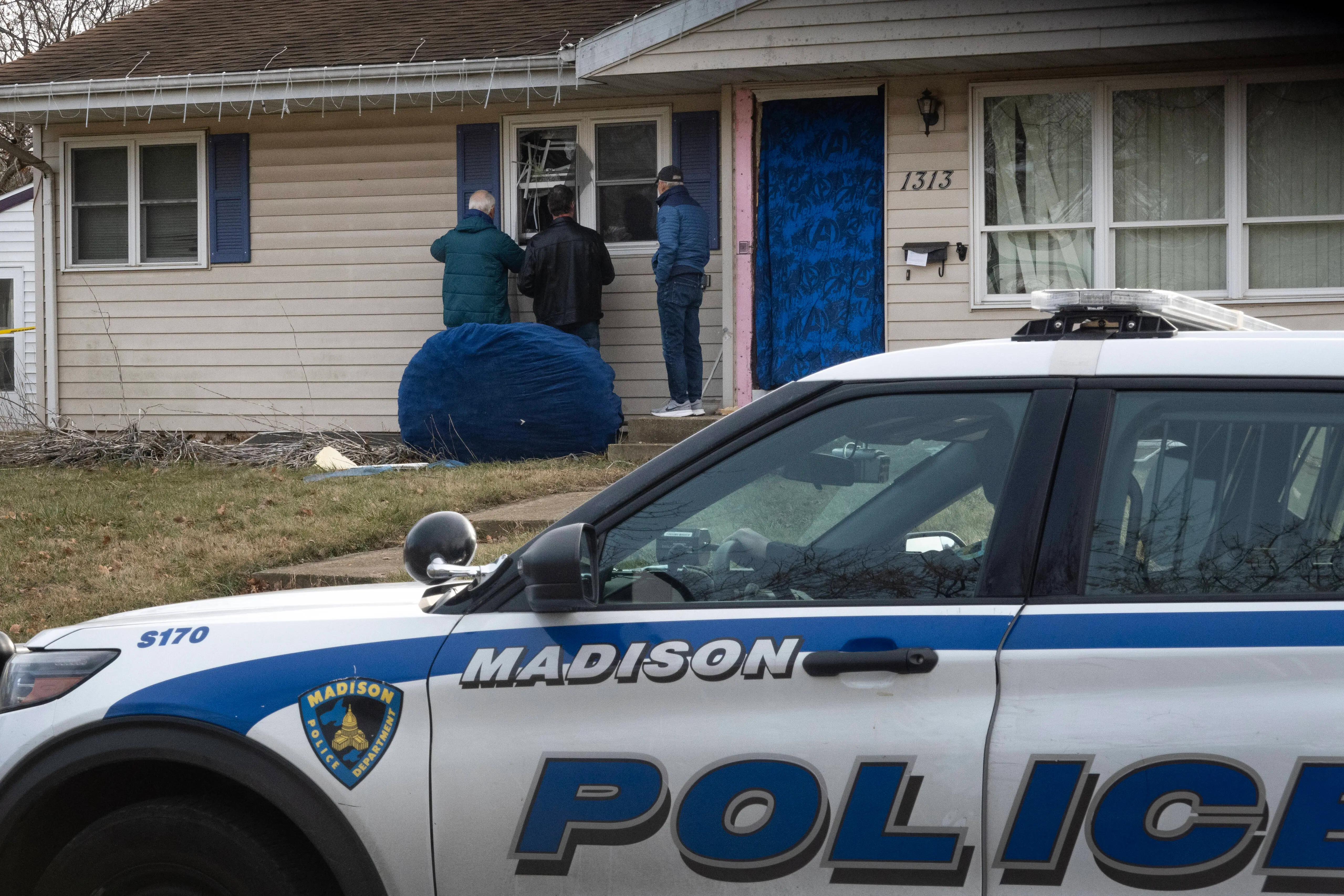 MADISON, WISCONSIN - DECEMBER 17: Workers repair the home of 15-year-old Natalie Rupnow that was reported to have been damaged as police made entry yesterday on December 17, 2024 in Madison, Wisconsin. Rupnow is reported to have been the student who opened fire at Abundant Life Christian School yesterday, shooting multiple people and killing at least two before killing herself. (Photo by Scott Olson/Getty Images)
