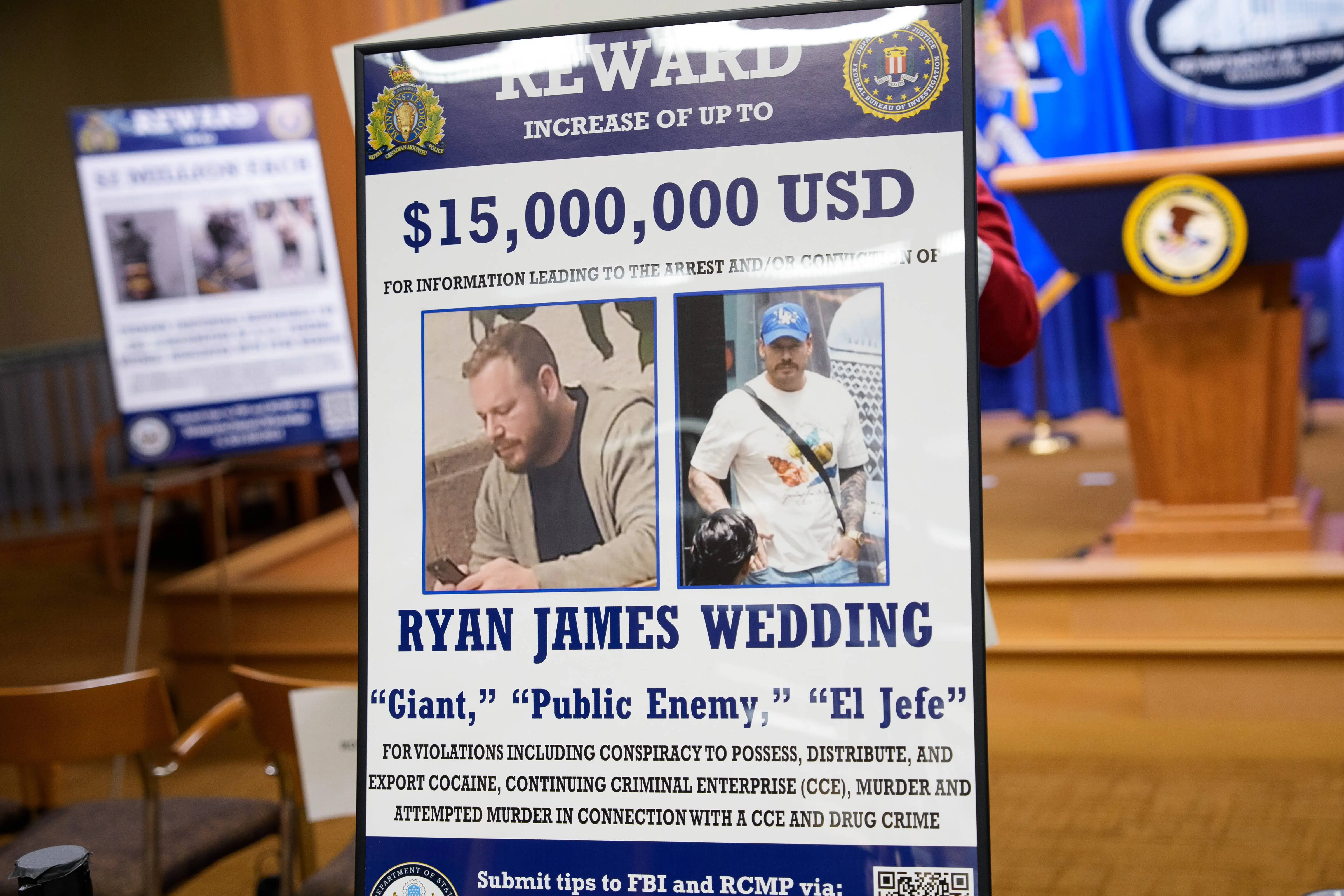 WASHINGTON, DC - NOVEMBER 19: A reward poster for the arrest of Ryan James Wedding is visible following a news conference announcing the indictment of a former Olympic snowboarder Ryan Wedding, charging him with murder and money laundering in connection to a drug trafficking organization at the Justice Department on November 19, 2025 in Washington, DC. The Justice Department announced a fifteen-million-dollar reward for information leading to the arrest of Ryan James Wedding, the leader of a criminal drug organization who smuggled large quantities of cocaine through Colombia and Mexico for distribution in the United States and Canada. (Photo by Andrew Harnik/Getty Images)