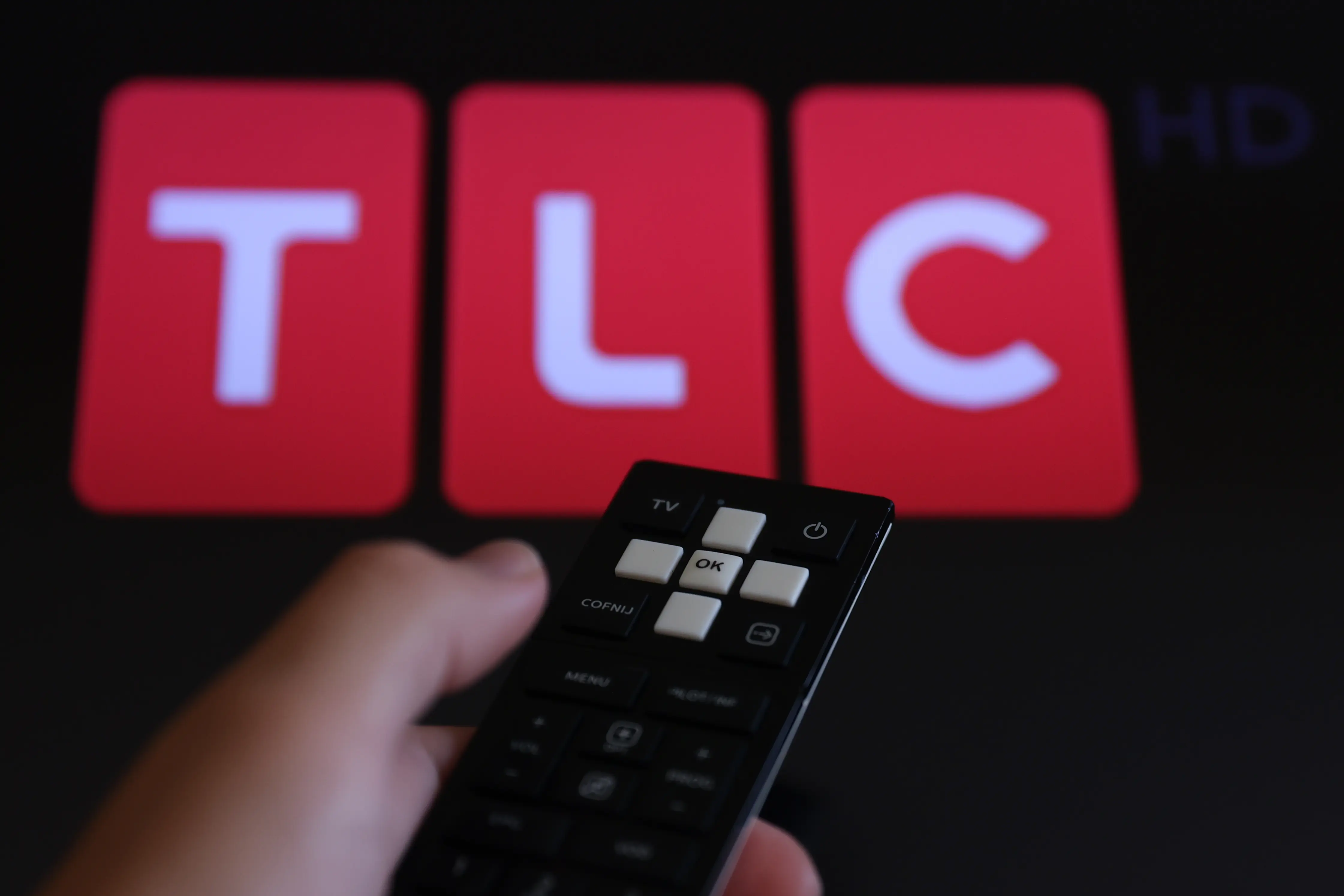 TLC logo displayed on a tv screen and a remote control are seen in this illustration photo taken in Poland on August 7, 2024. (Photo by Jakub Porzycki/NurPhoto via Getty Images)