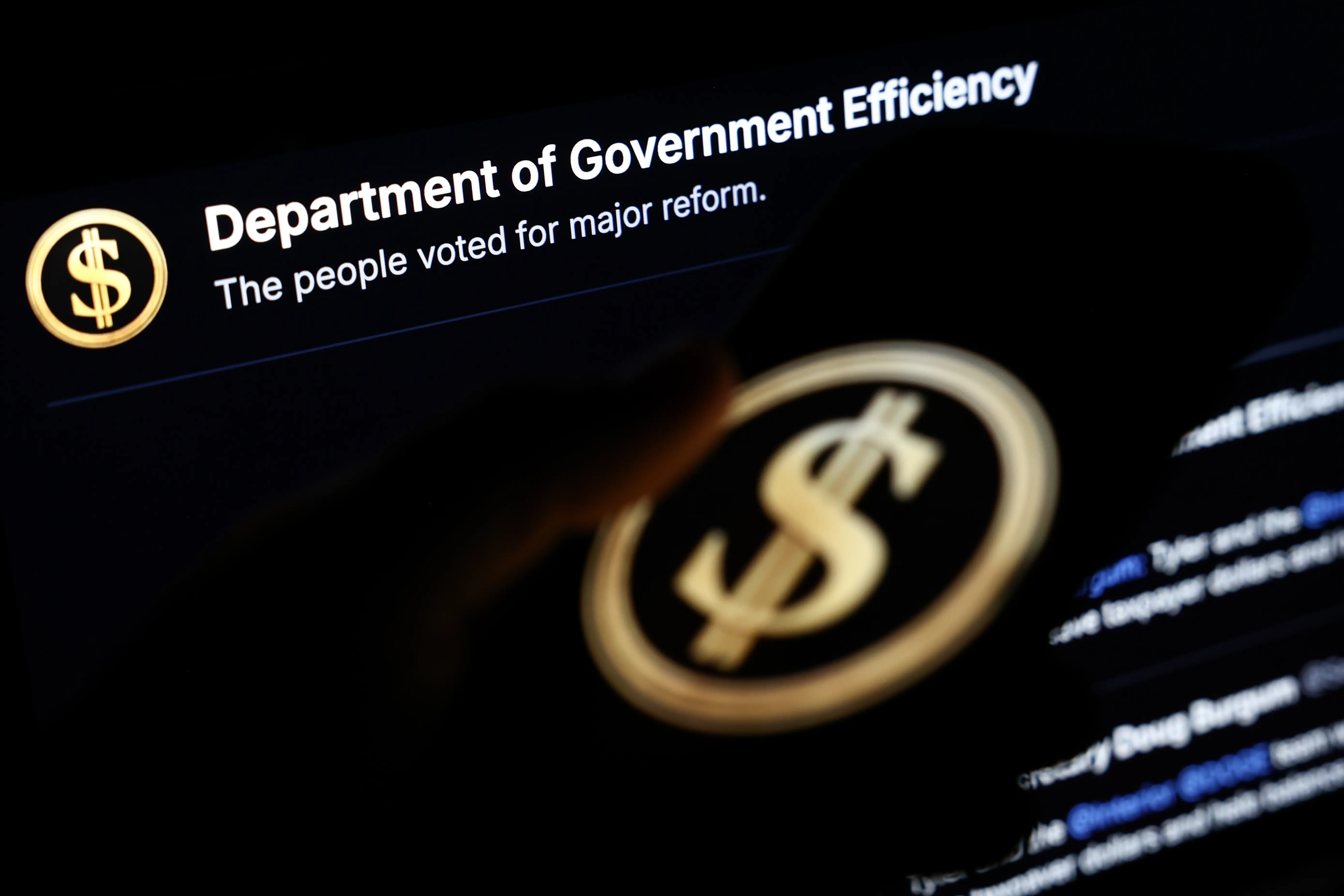 Department of Government Efficiency website displayed on a laptop screen and Department of Government Efficiency logo displayed on a phone screen are seen in this illustration photo taken in Krakow, Poland on March 28, 2025. (Photo by Jakub Porzycki/NurPhoto via Getty Images)