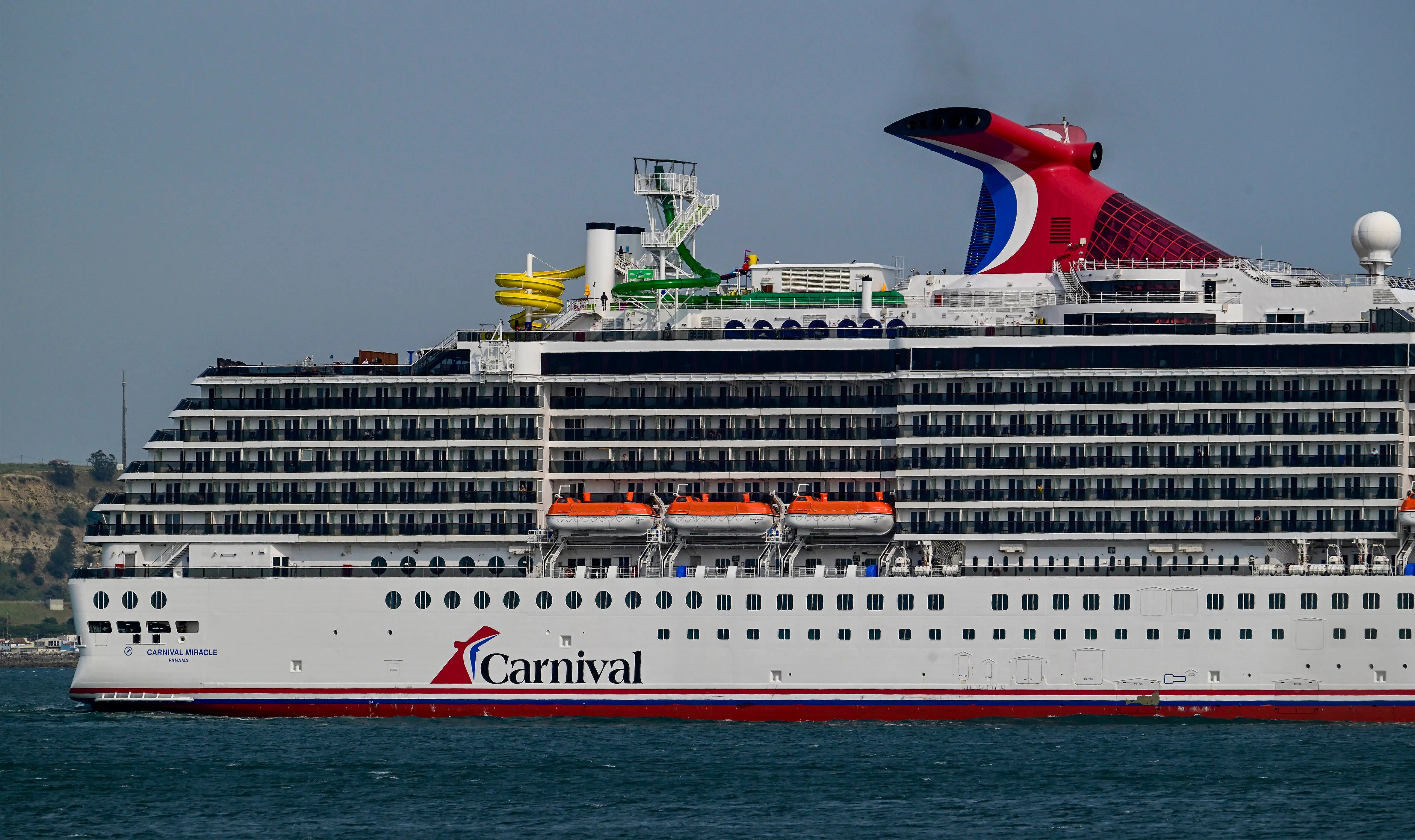 LISBON, PORTUGAL - JUNE 03: Carnival Miracle, a 88,500 GT Spirit-class cruise ship operated by Carnival Cruise Line, sails the Tagus River after departure from the cruise terminal on June 03, 2025, in Lisbon, Portugal. Tourism in Portugal reached record figures in 2024, exceeding 27 billion euros in revenue, an increase of 8.8% compared to 2023. (Photo by Horacio Villalobos#Corbis/Corbis via Getty Images)