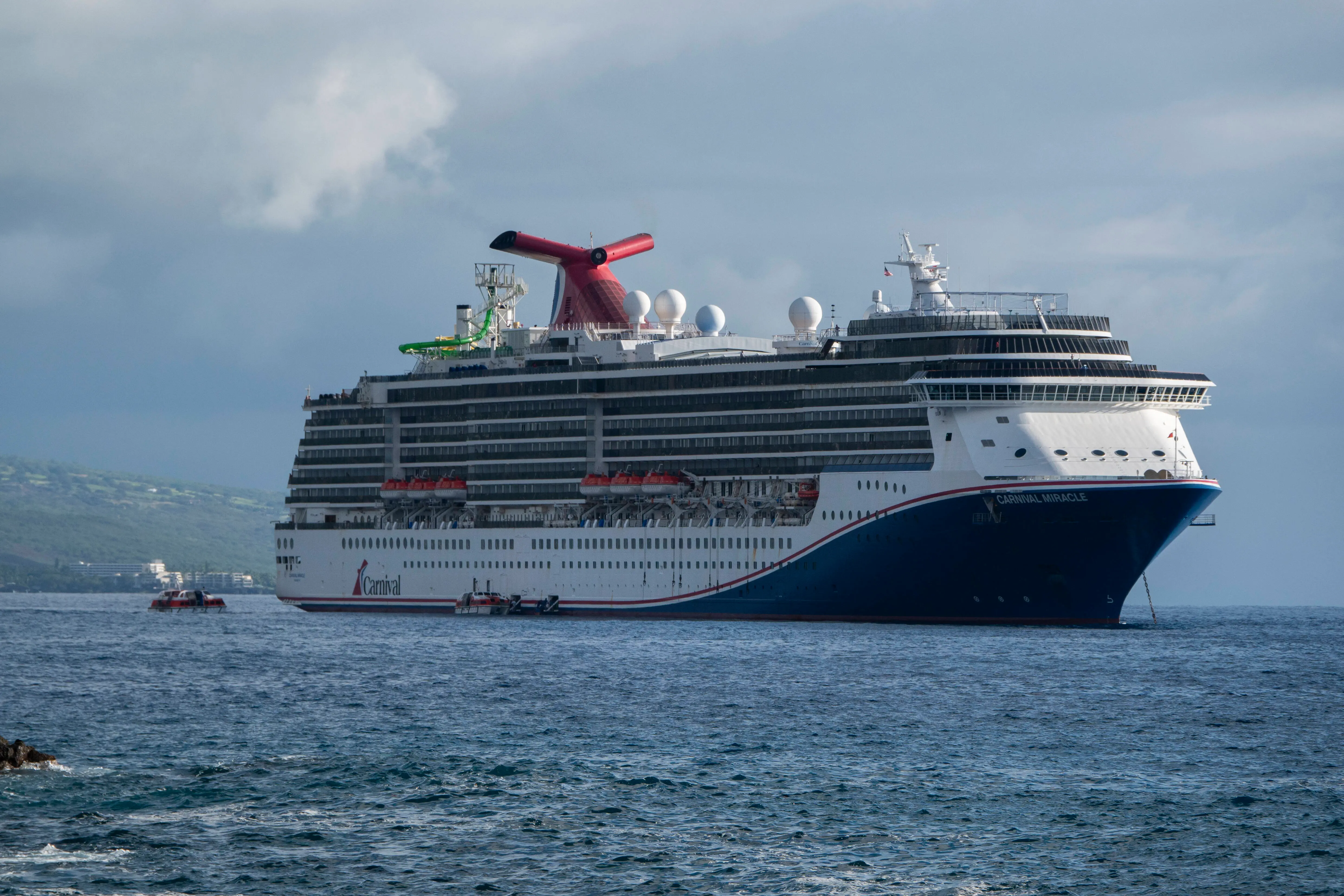 KAILUA-KONA, HAWAII- JANUARY 14: The Carnival Miracle cruise ship is anchored in the Pacific Ocean near Kailua Bay during a 15-day cruise on January 14, 2024 in Kailua-Kona, Hawaii.  (Photo by Kevin Carter/Getty Images)