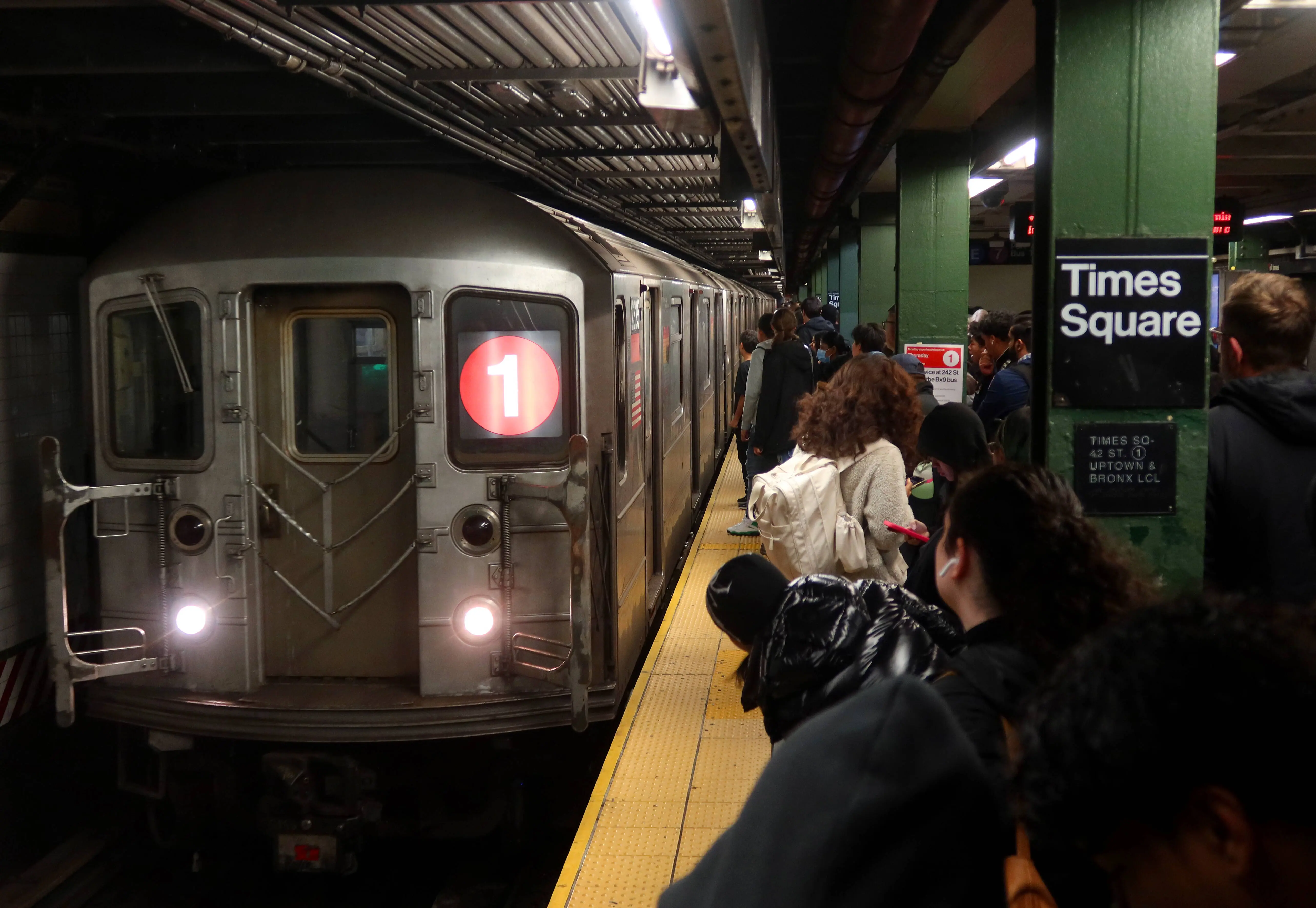 People wait to board a 1-line subway train at the Times Square station on November 12, 2024, in New York City. (Photo by Gary Hershorn/Getty Images)