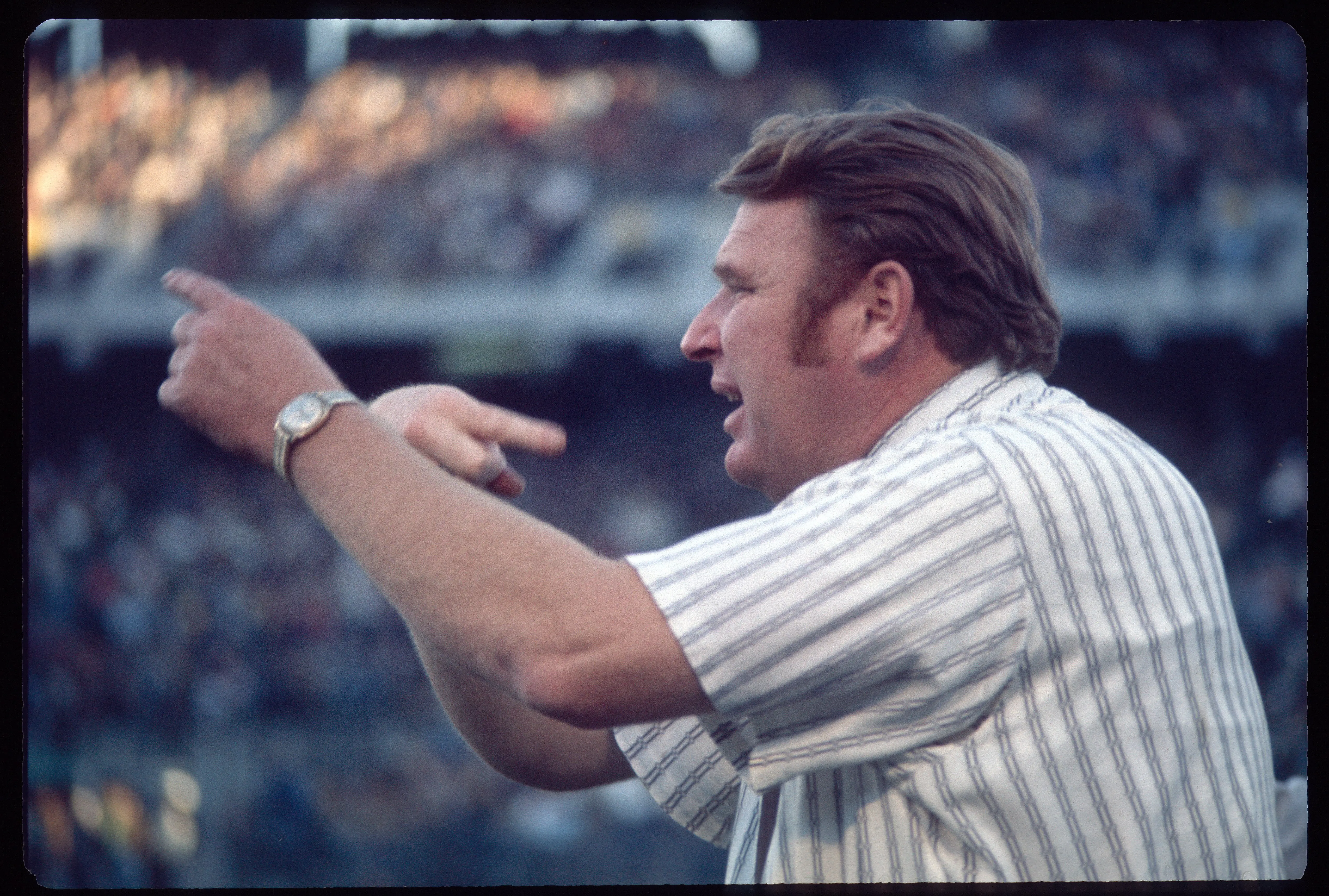 OAKLAND, CA - CIRCA 1970's:  John Madden head coach of the Oakland Raiders coaches from the sideline during a circa 1970s NFL game at the Oakland Coliseum in Oakland, California. Madden coached the Raiders from 1969-78. (Photo by Focus on Sport/Getty Images)