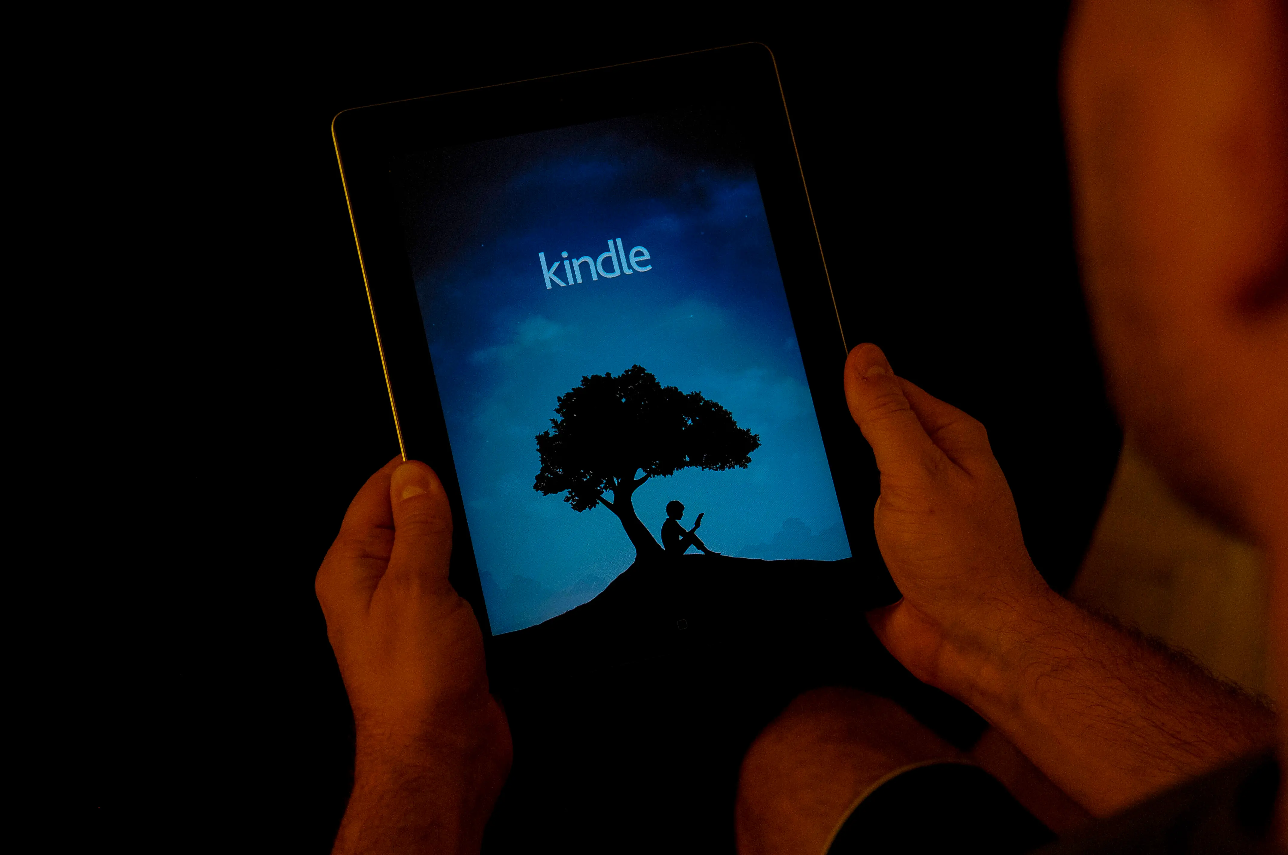 A man is seen using the Amazon Kindle application on an iPad on November 2, 2017. (Photo by Jaap Arriens/NurPhoto via Getty Images)