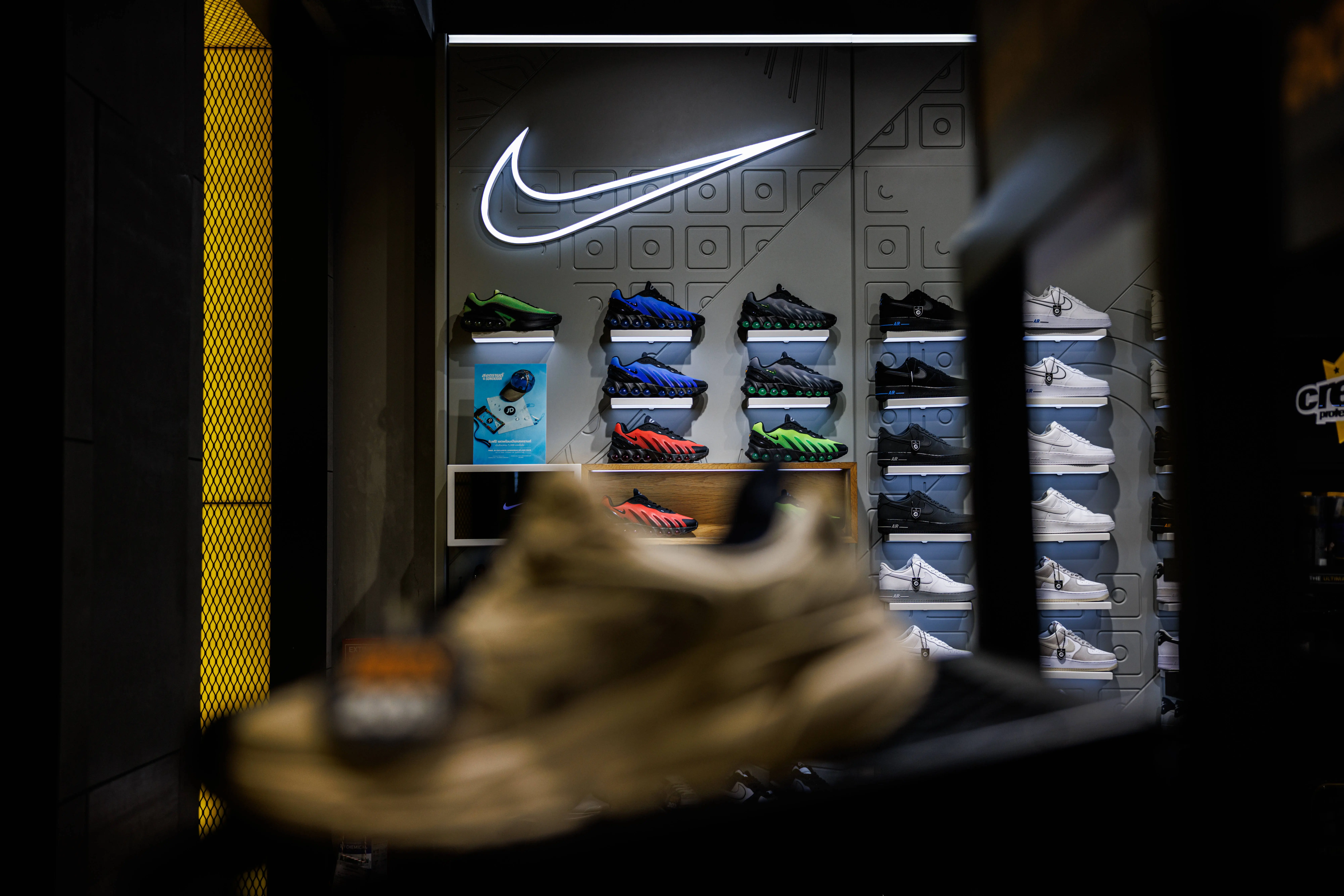 BANGKOK, THAILAND - APRIL 03: Nike shoes are displayed at the Nike store at Siam Center mall on April 03, 2025 in Bangkok, Thailand. U.S. President Donald Trump's "Liberation Day" tariffs have driven down the share prices of consumer goods companies like Nike, as higher import costs from affected countries are expected to squeeze profit margins and lead to increased retail prices, reducing consumer demand in the U.S. (Photo by Lauren DeCicca/Getty Images)