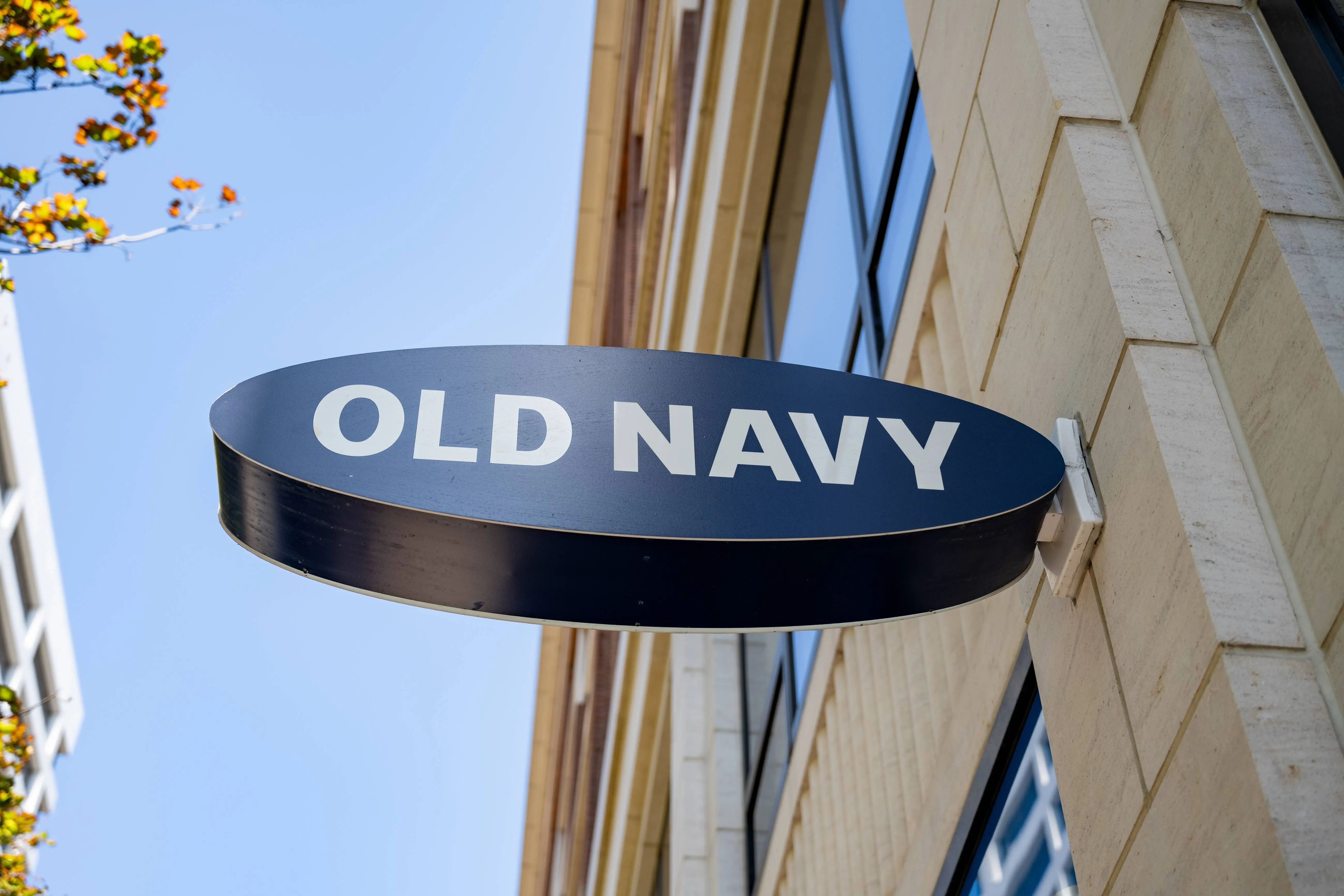 Old Navy oval storefront sign projecting from building facade on a sunny day, San Francisco, California, August 29, 2025. (Photo by Smith Collection/Gado/Getty Images)