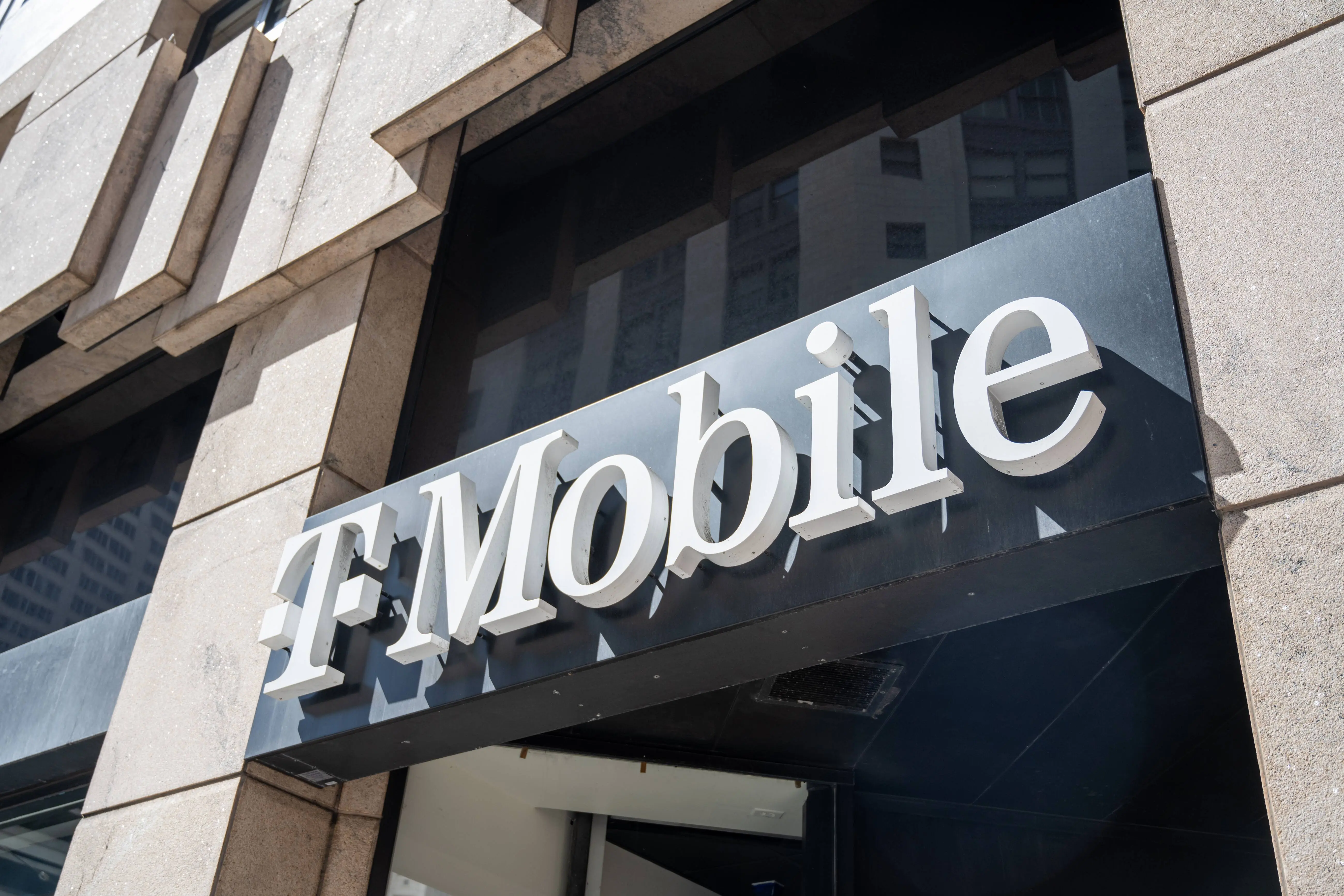 T-Mobile store exterior with logo sign on stone facade on a sunny day, San Francisco, California, May 13, 2025. (Photo by Smith Collection/Gado/Getty Images)