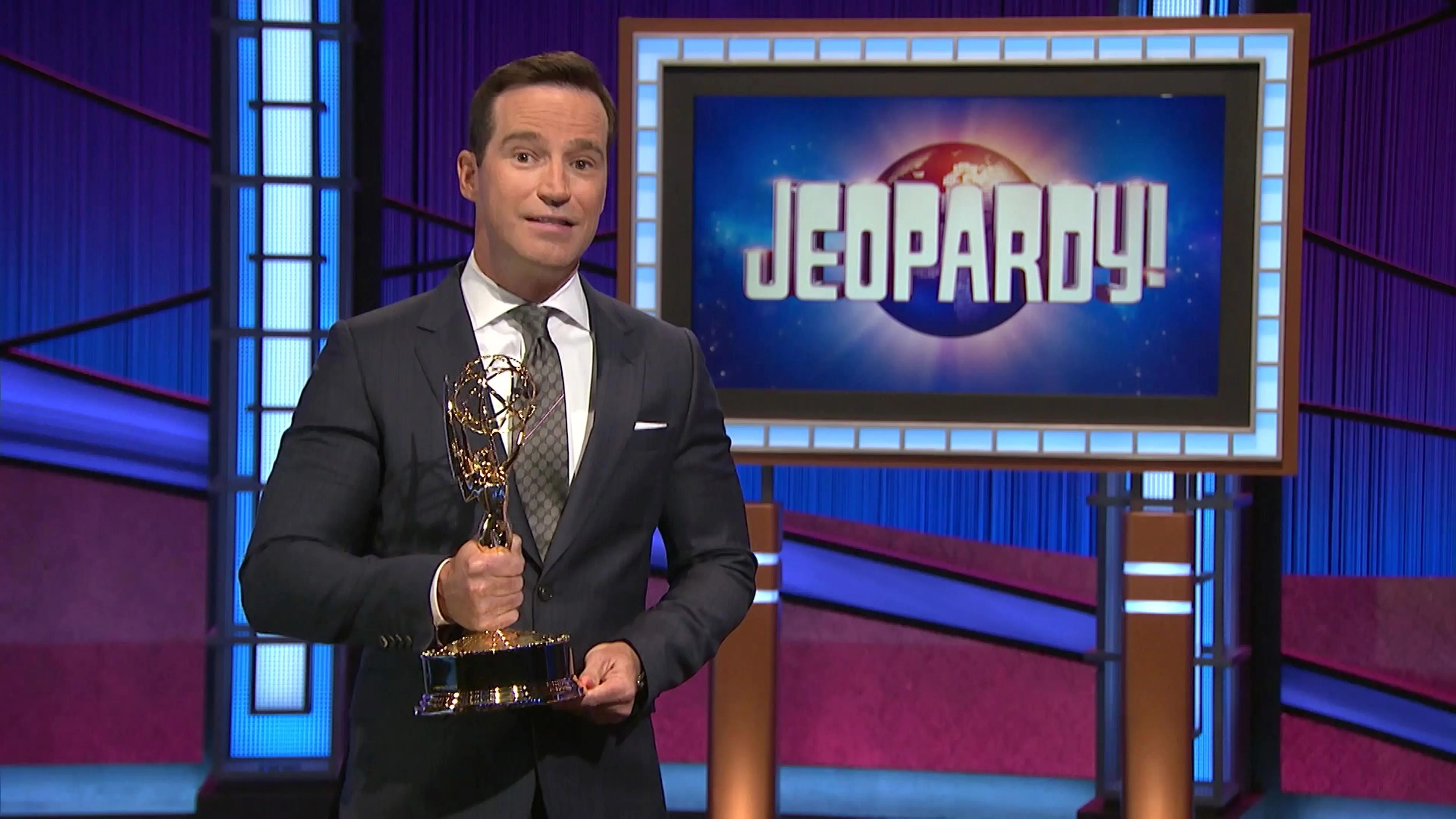 Mike Richards accepts the award for Outstanding Game Show for Jeopardy! (Image via Getty)