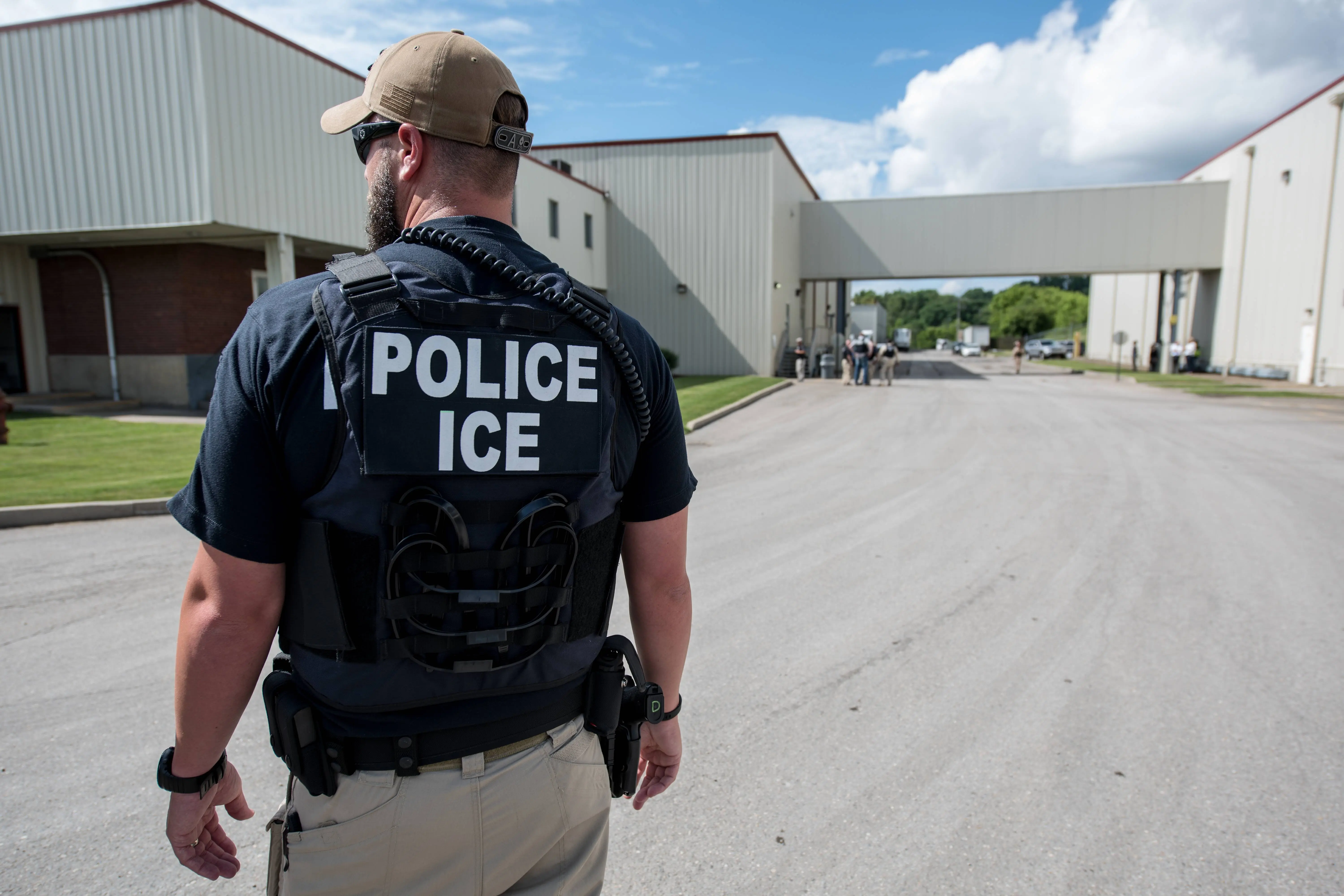 US Immigration and Customs Enforcement's (ICE) special agent preparing to arrest alleged immigration violators at Fresh Mark, Salem, June 19, 2018. Image courtesy ICE ICE / U.S. Immigration and Customs Enforcement. (Photo by Smith Collection/Gado/Getty Images)