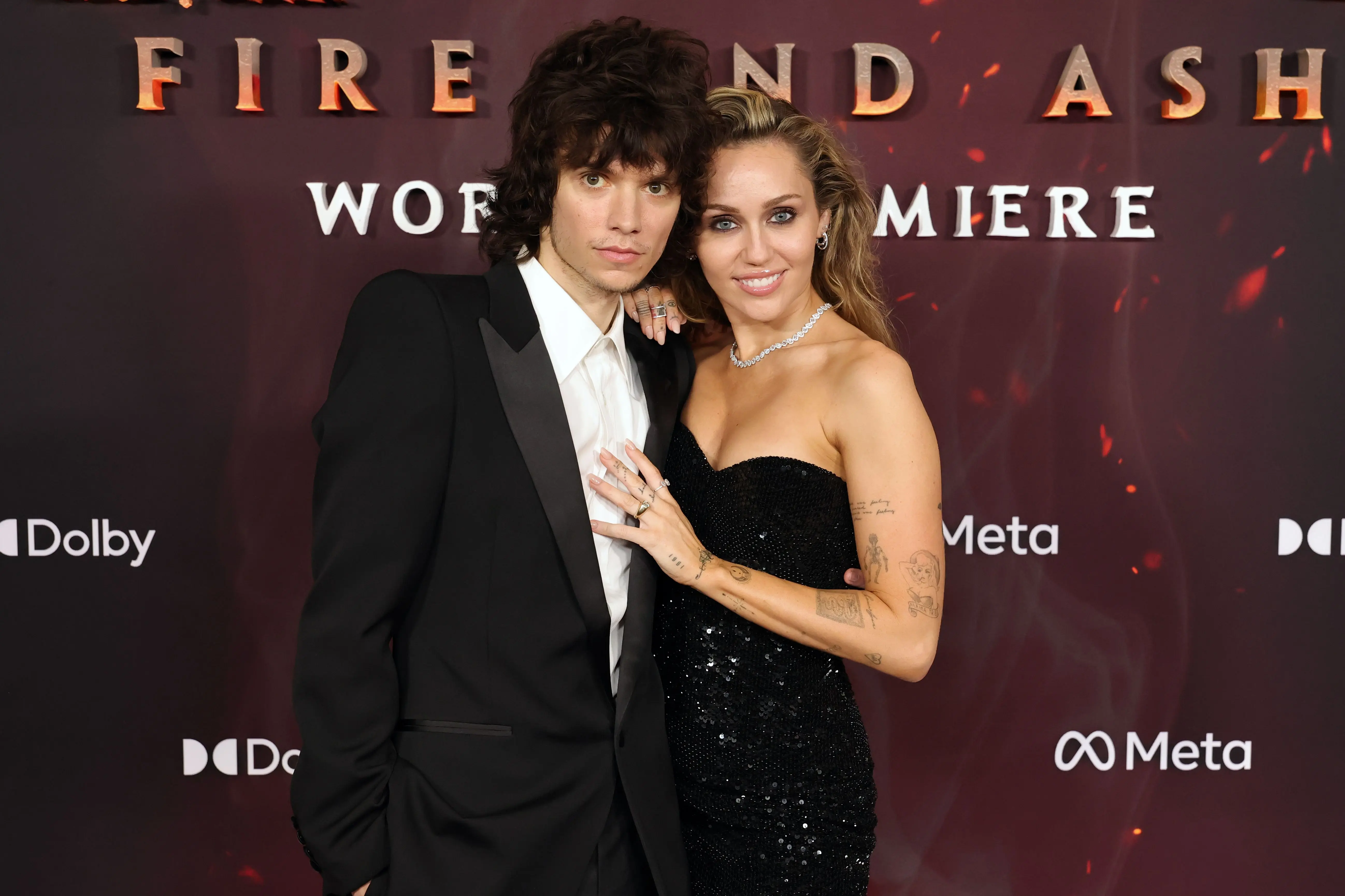 HOLLYWOOD, CALIFORNIA - DECEMBER 01: (L-R) Maxx Morando and Miley Cyrus attend the Global Premiere of 20th Century Studios' "Avatar: Fire And Ash" at Dolby Theatre on December 01, 2025 in Hollywood, California. (Photo by Kevin Winter/WireImage)