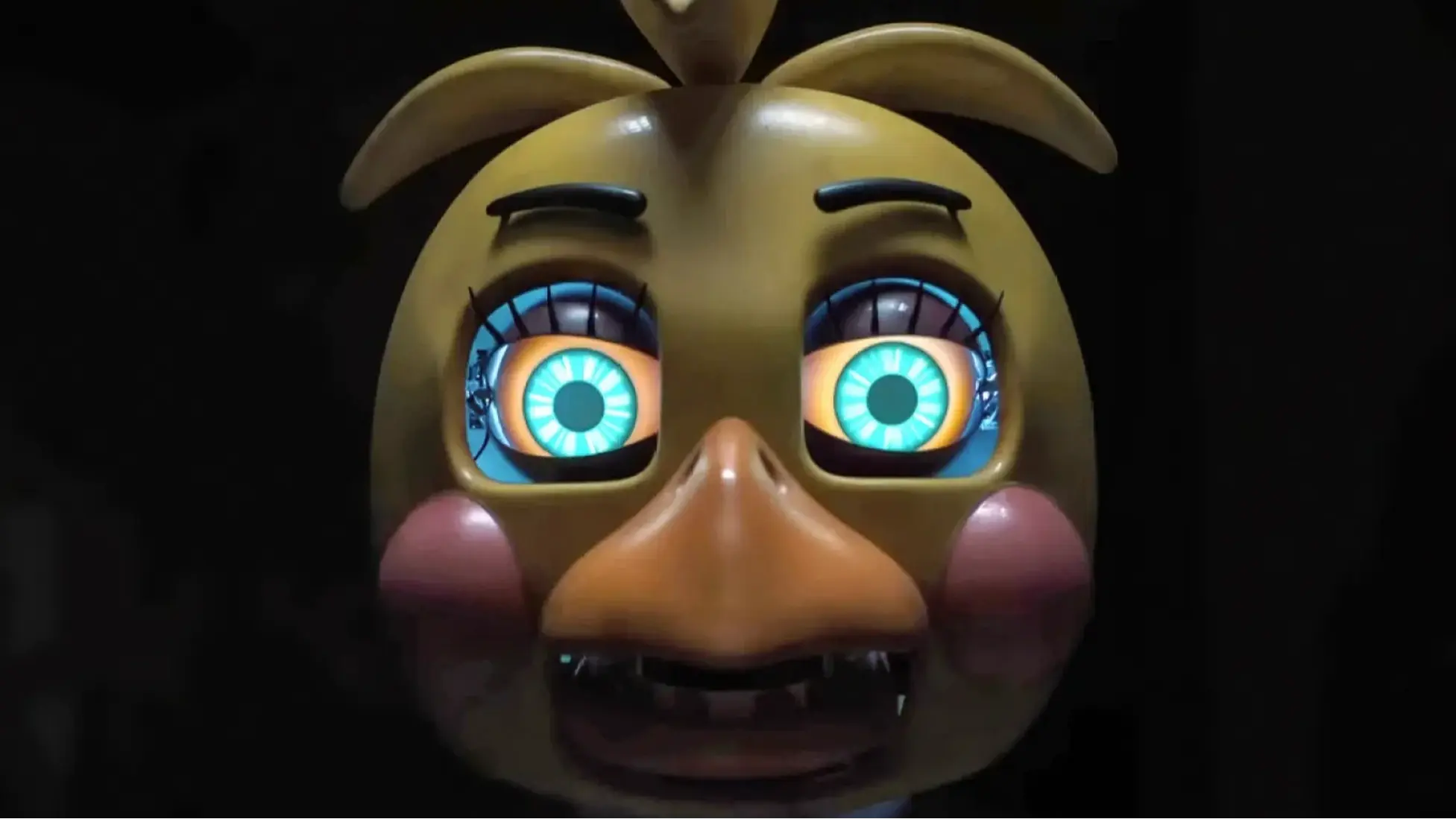 Toy Chica close up from Five Nights at Freddy’s 2, a trailer still that hints at the Marionette’s hold. Image via Universal Pictures