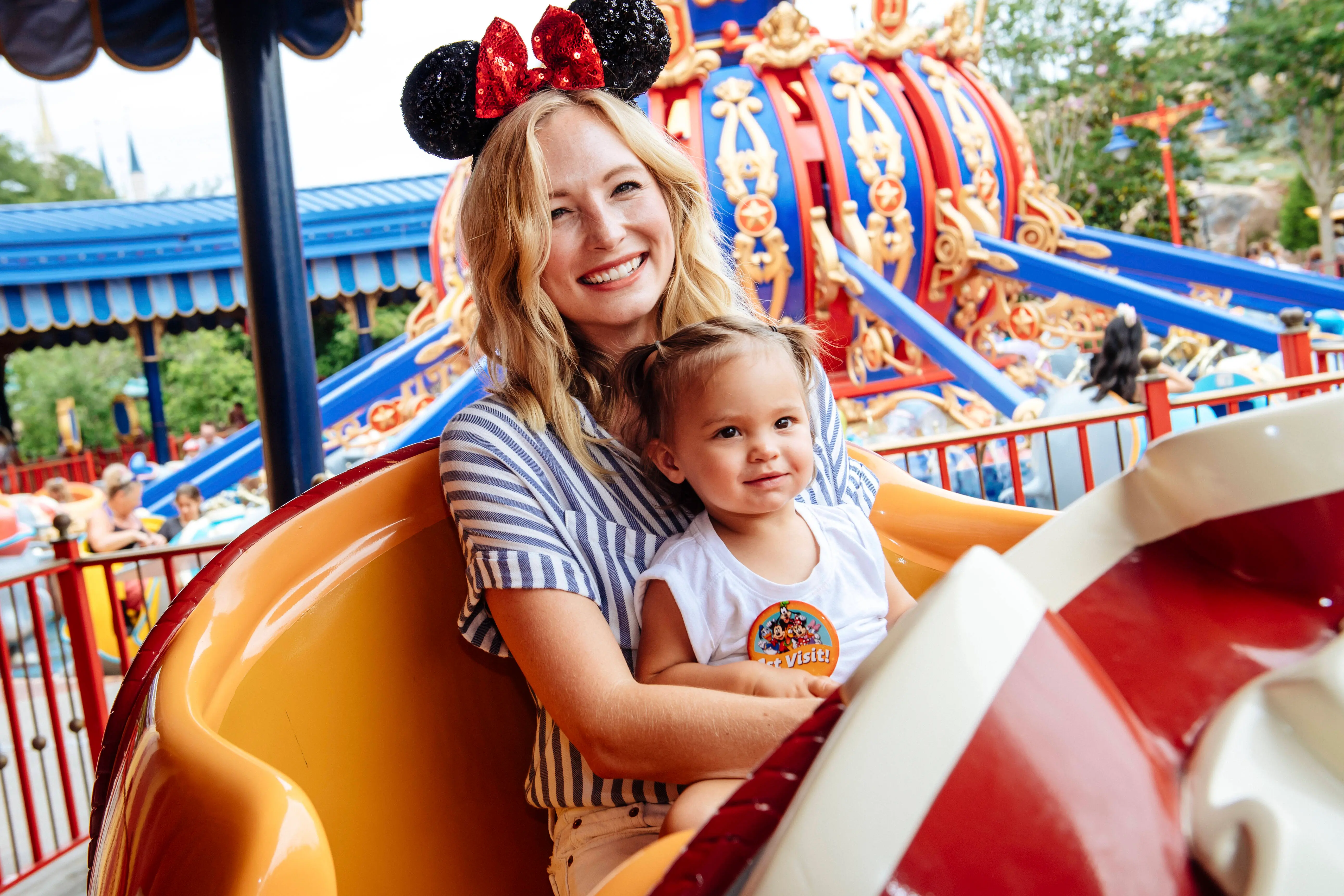 LAKE BUENA VISTA, FL - JUNE 14: In this handout image provided by Disney, Actress Candice Accola shares a special moment with her daughter, Florence May, after taking flight on Dumbo The Flying Elephant at Magic Kingdom Park on June 14, 2017 in Lake Buena Vista, Florida. Accola spent time vacationing with family and friends at Walt Disney World Resort in between projects. (Phot by Chloe Rice/Disney via Getty Images)