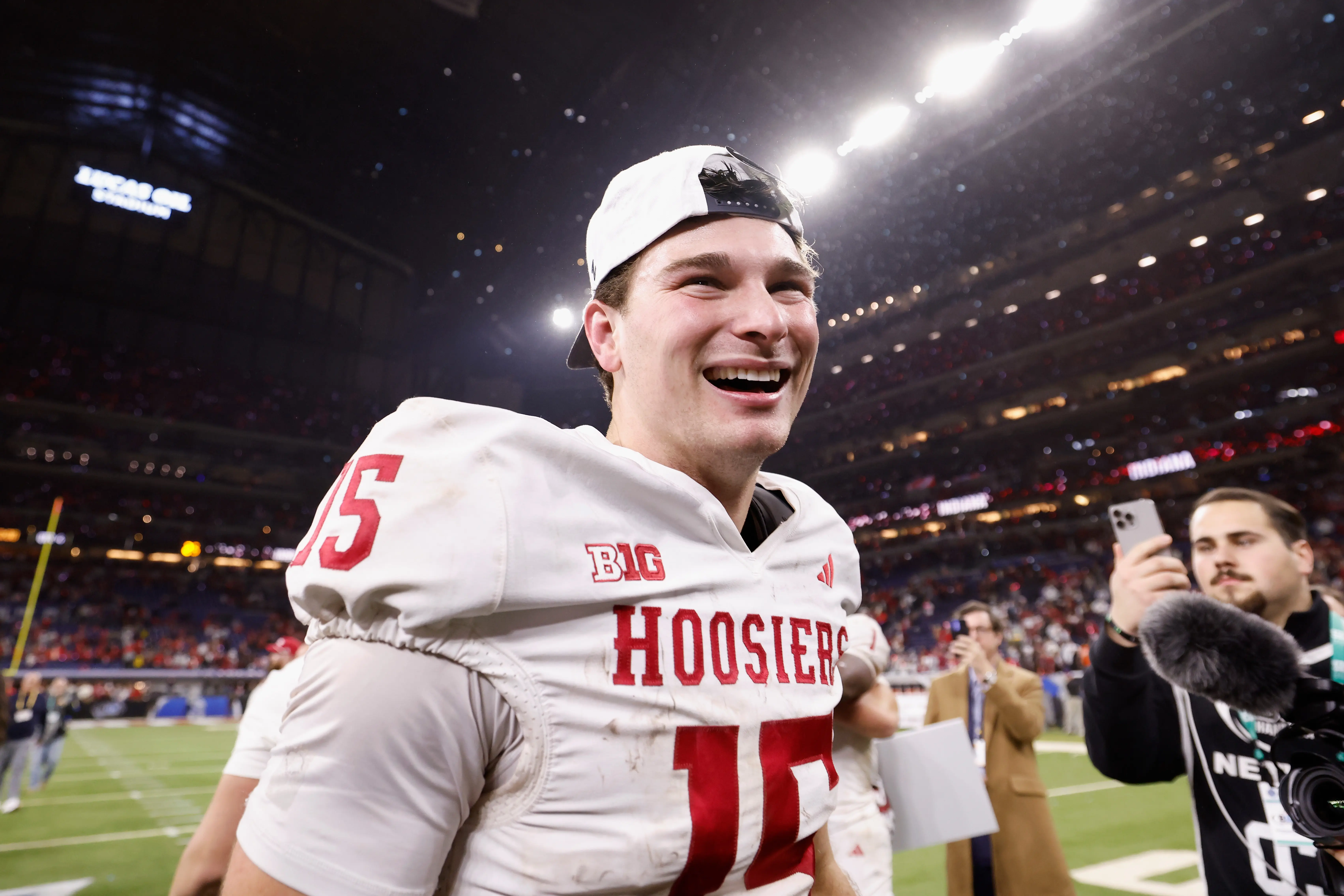 Fernando Mendoza #15 of the Indiana Hoosiers celebrates after defeating the Ohio State Buckeyes 13-10 in the 2025 Big Ten Football Championship at Lucas Oil Stadium on December 06, 2025 in Indianapolis, Indiana.  (Photo by Michael Reaves/Getty Images)